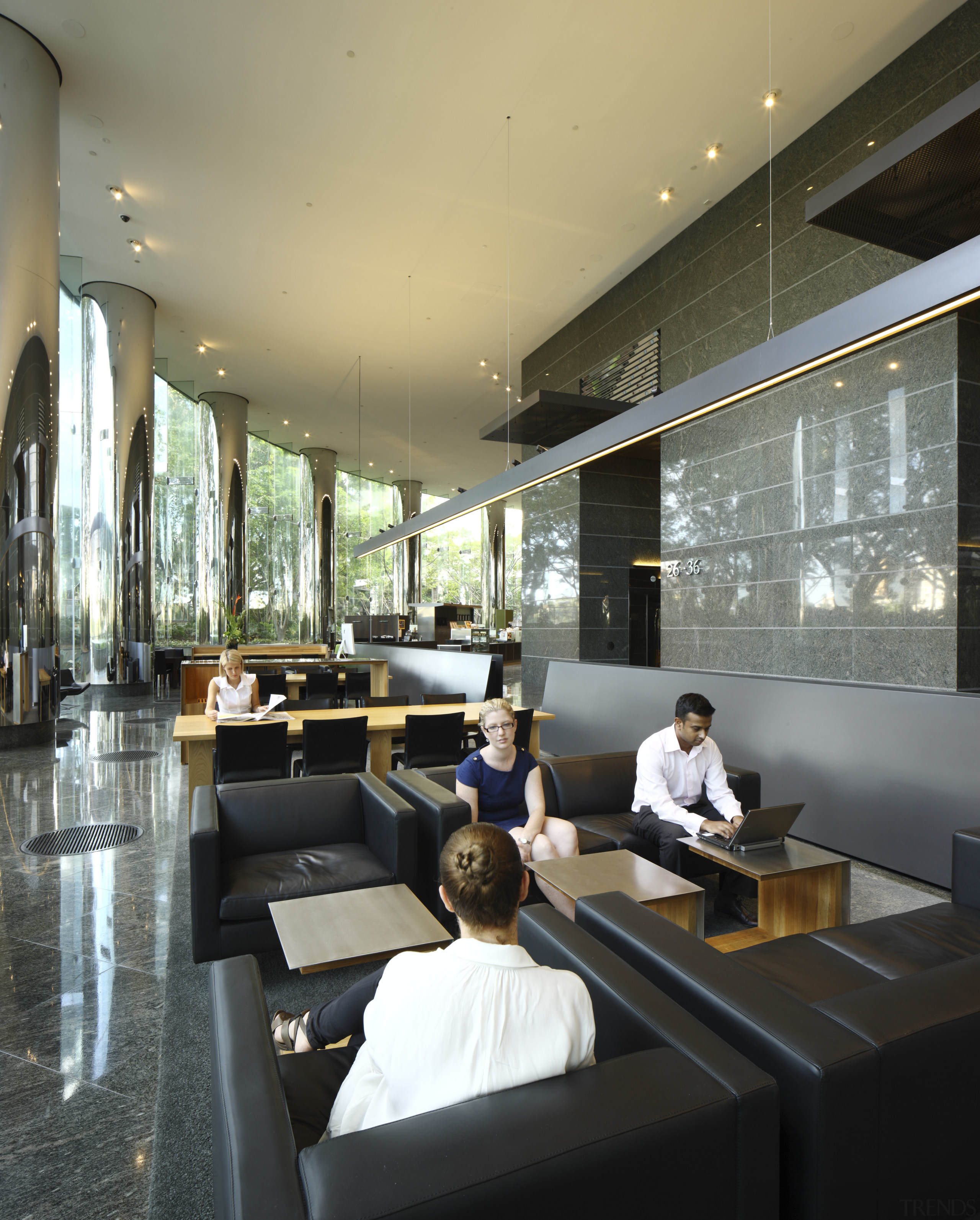 Seating area with black seats. - Seating area furniture, interior design, lobby, restaurant, black, gray
