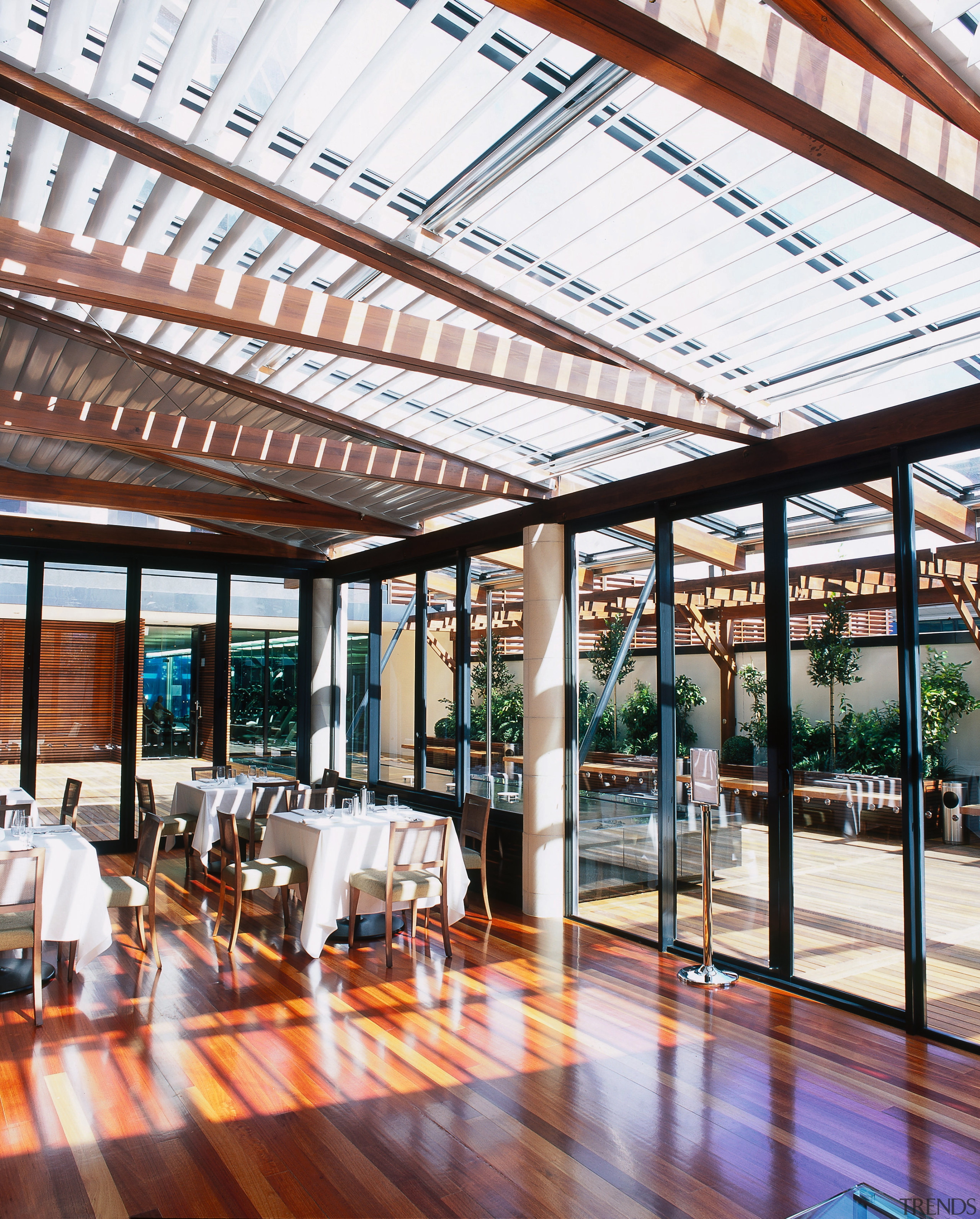 Outdoor lounge and restaurant area with tables andchairs, daylighting, outdoor structure, real estate, roof, structure, white, red