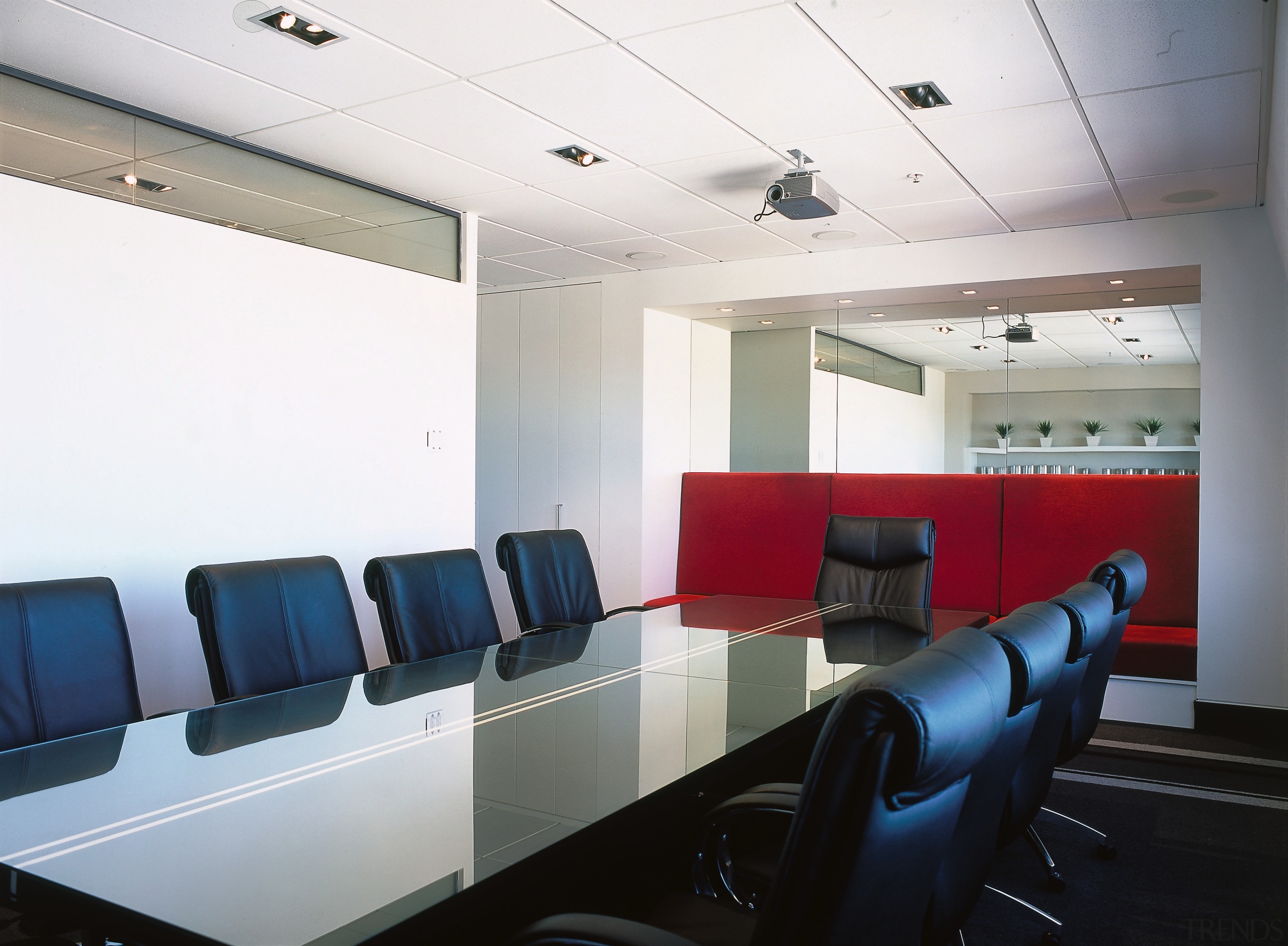 Boardroom with long table and upholstered chairs, white auditorium, ceiling, conference hall, interior design, office, white