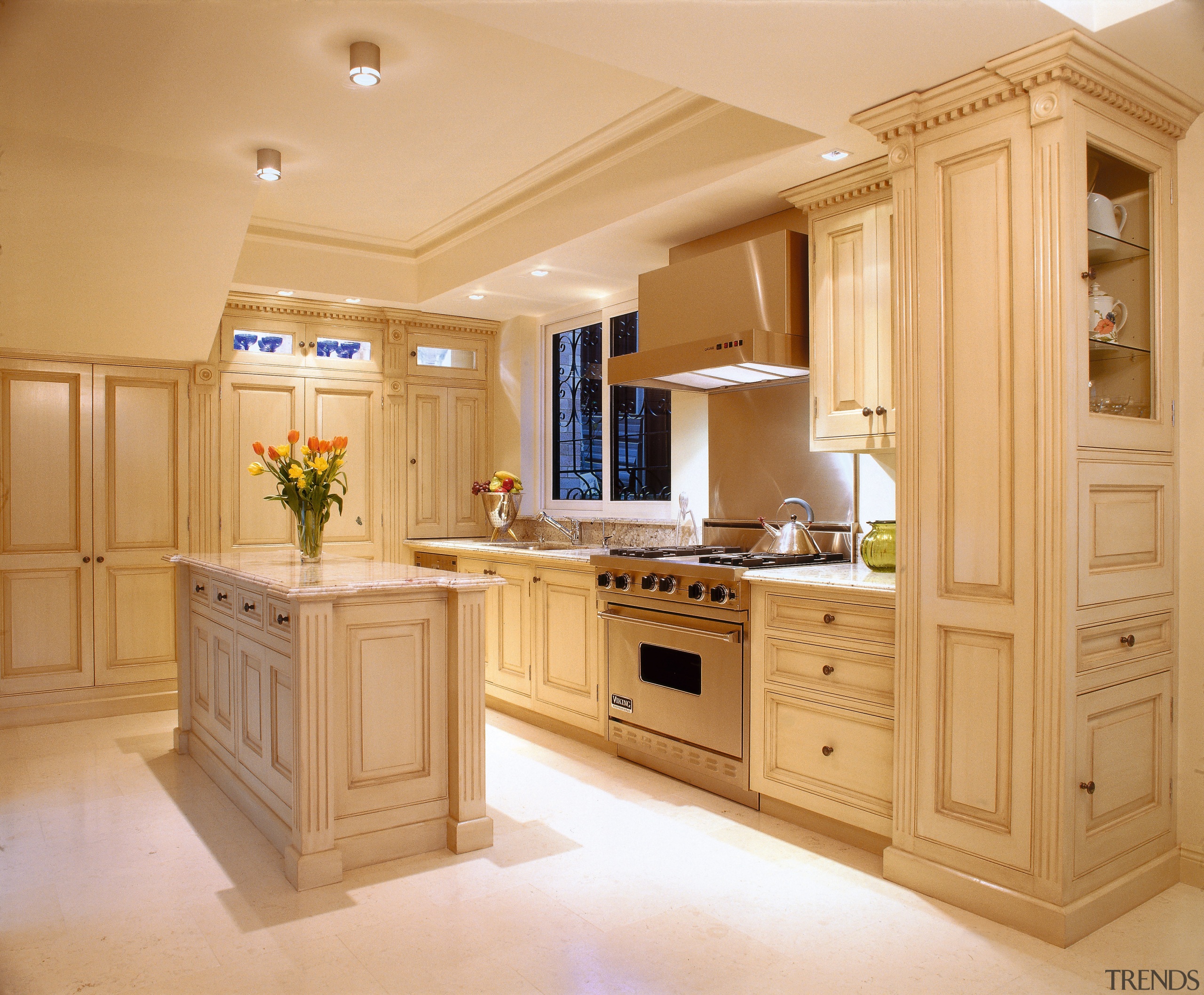 The robust building techinques used on this classic cabinetry, countertop, cuisine classique, interior design, kitchen, room, orange