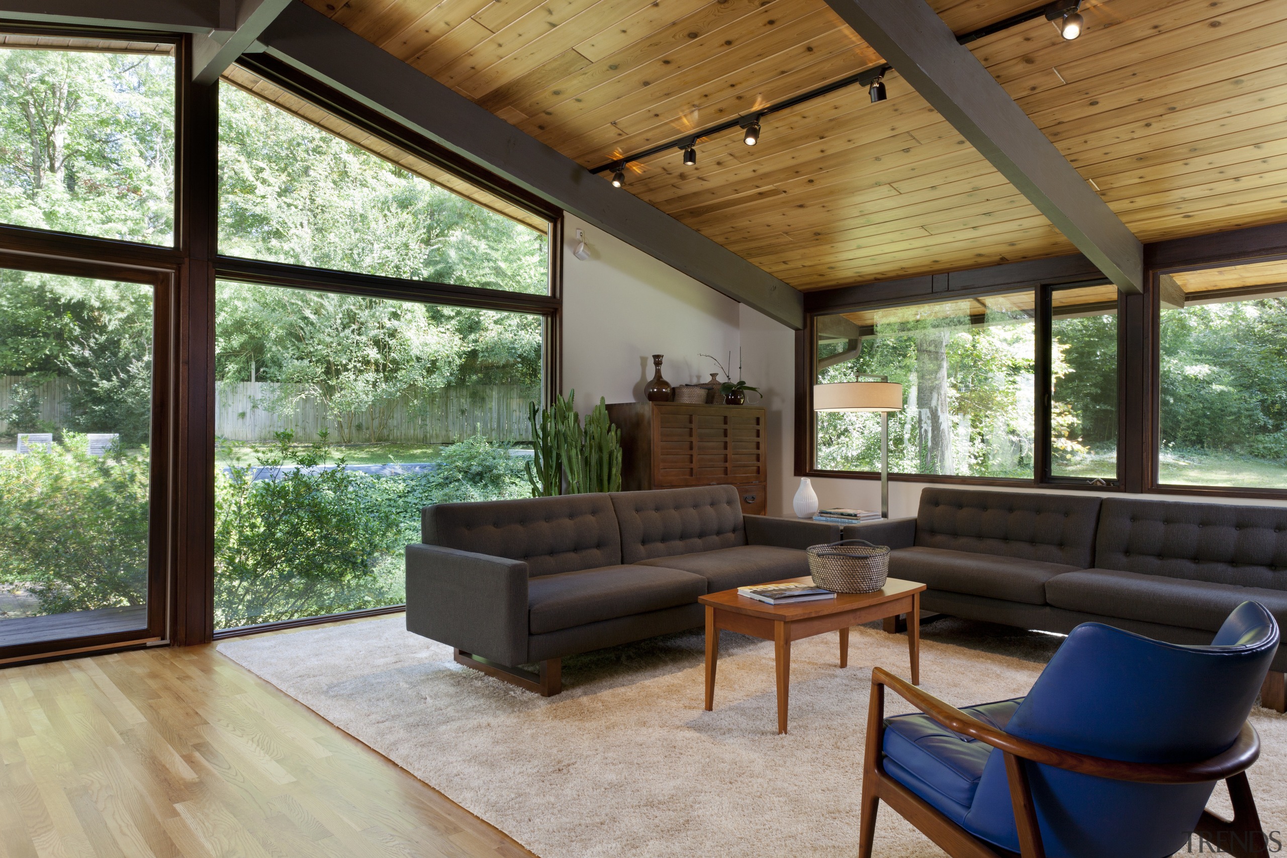 A family living area, positioned at the far architecture, ceiling, daylighting, estate, home, house, interior design, living room, real estate, roof, window, wood