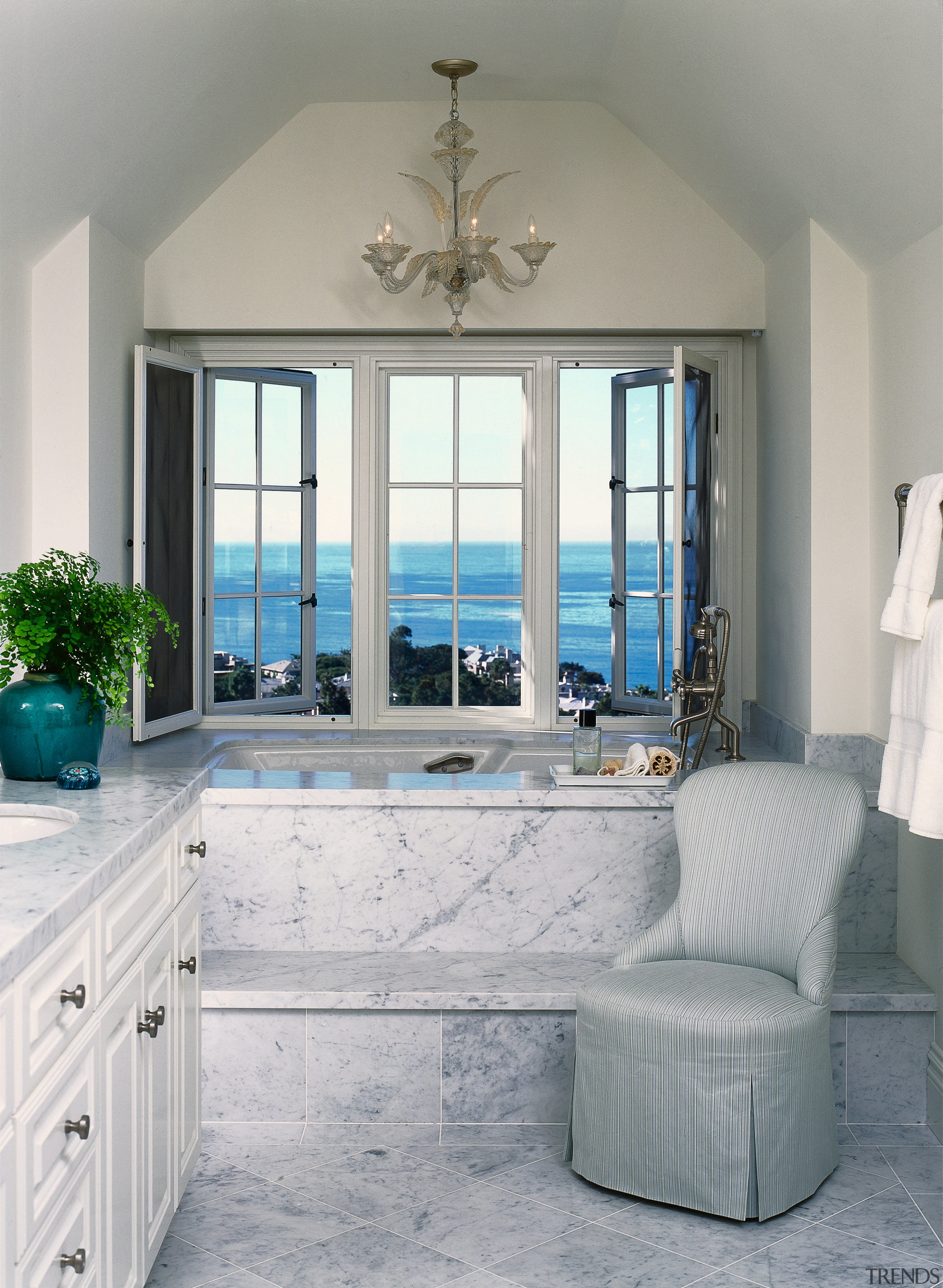 view of this bathroom featuring featuring raised bathtub floor, home, interior design, living room, room, wall, window, gray