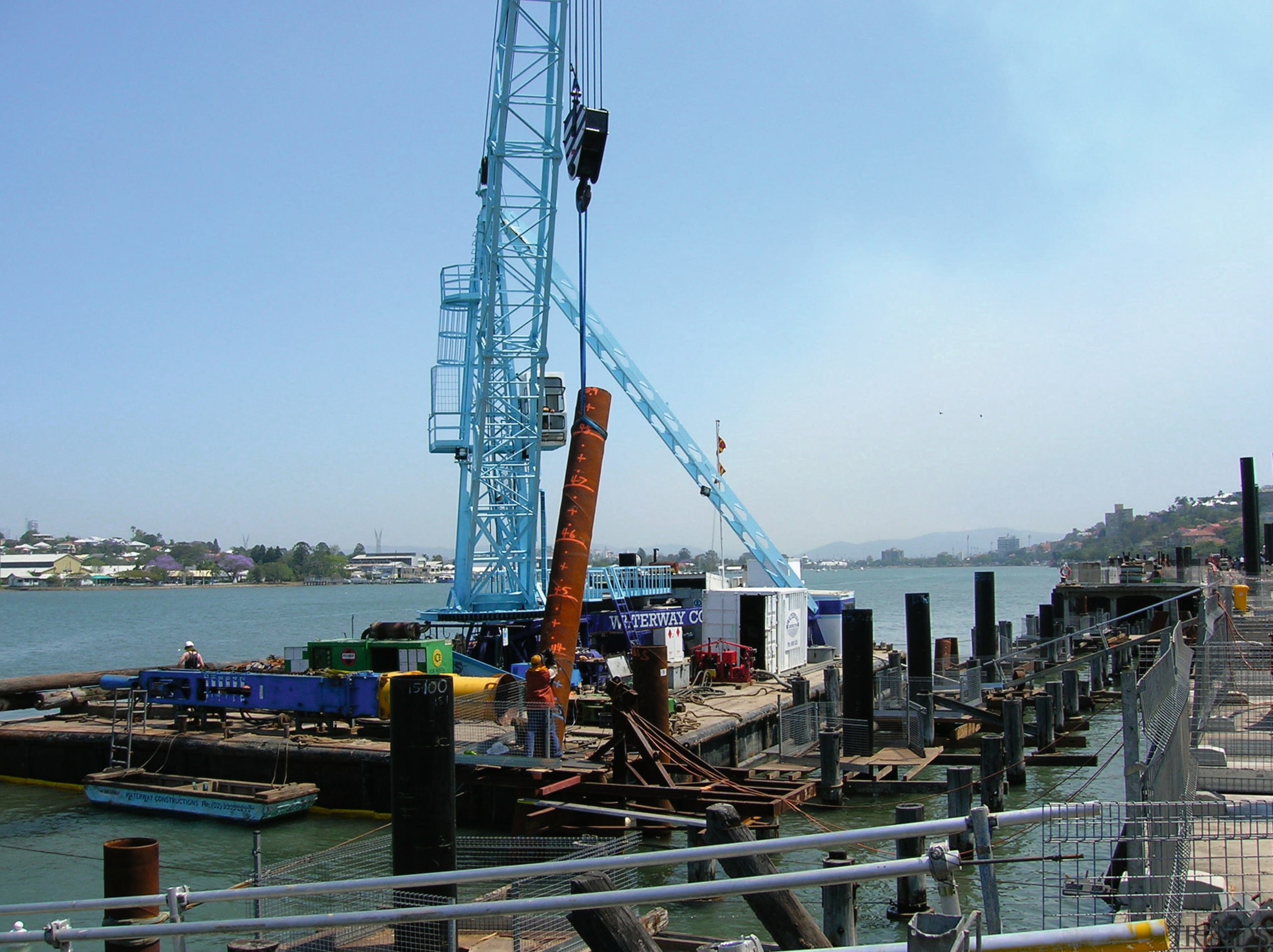 A view of the Portside Wharf  Waterway construction, crane, crane vessel floating, jackup rig, port, sea, teal