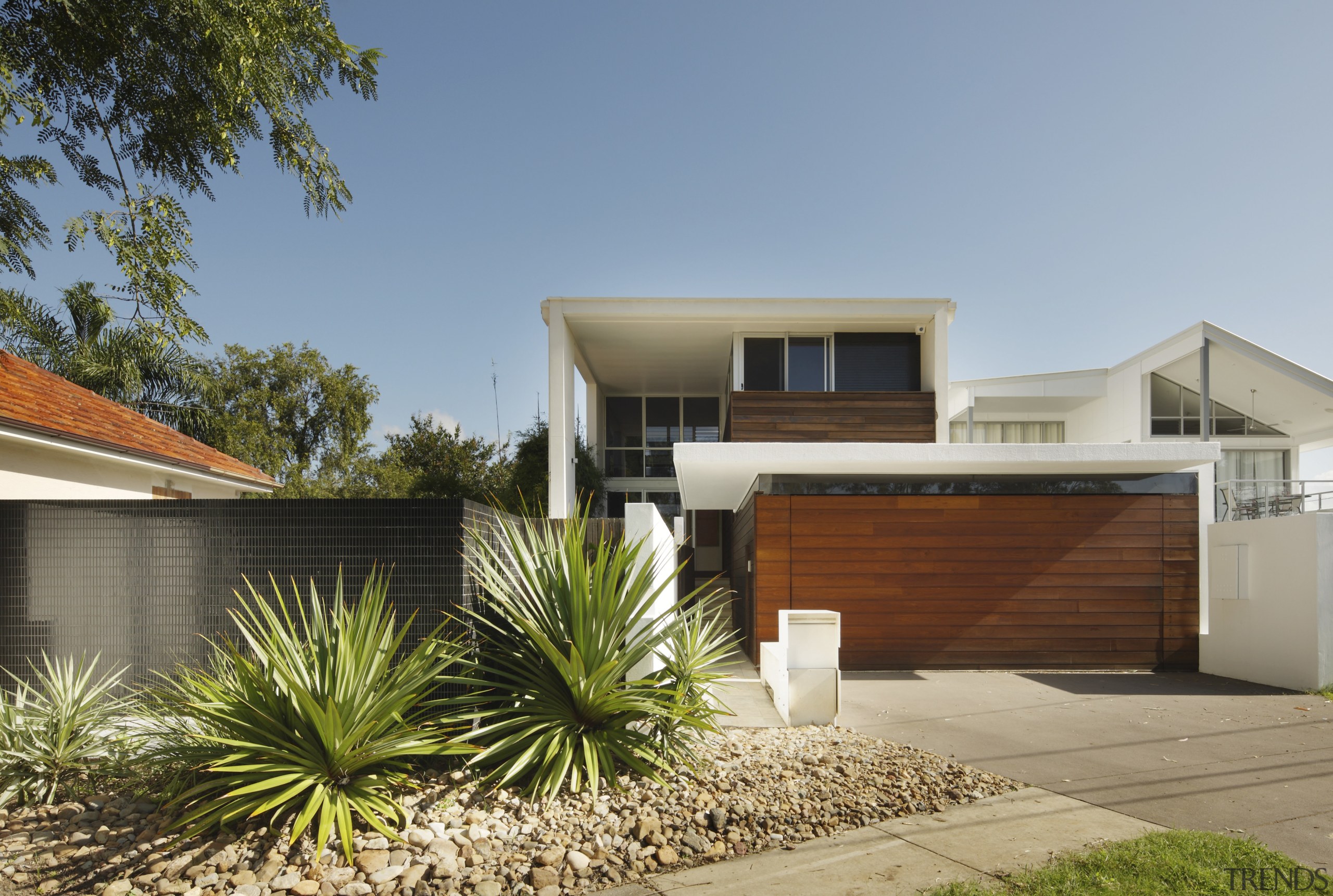 View of exterior from road with wooden garage architecture, elevation, estate, facade, home, house, property, real estate, residential area, brown, gray