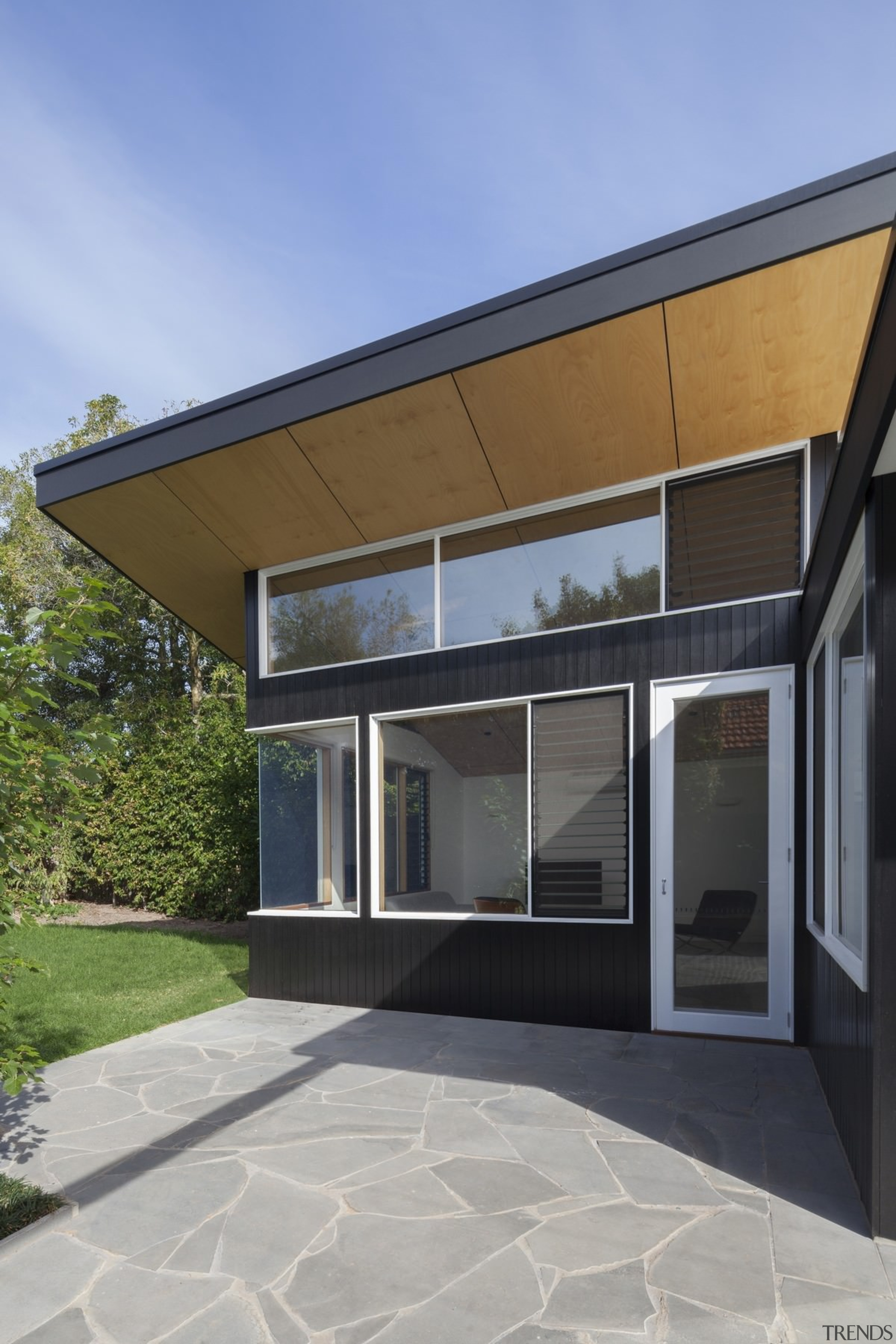 This large wood soffit runs around the living architecture, building, daylighting, elevation, facade, home, house, property, real estate, residential area, siding, villa, window, gray, teal
