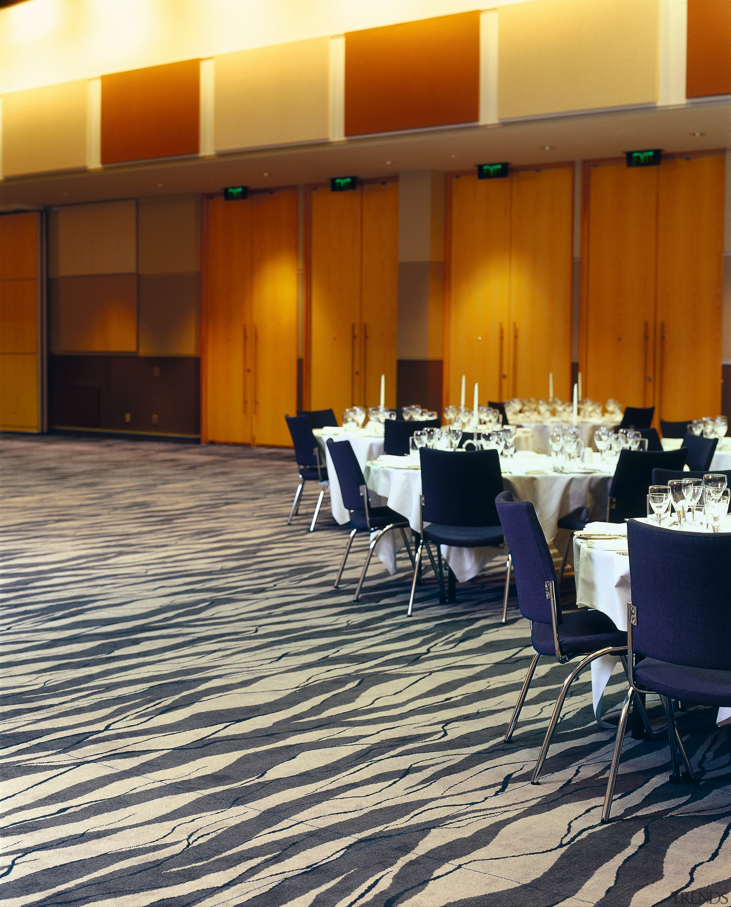 Large function room with cream and grey patterned carpet, conference hall, floor, flooring, function hall, interior design, restaurant, table, brown, orange