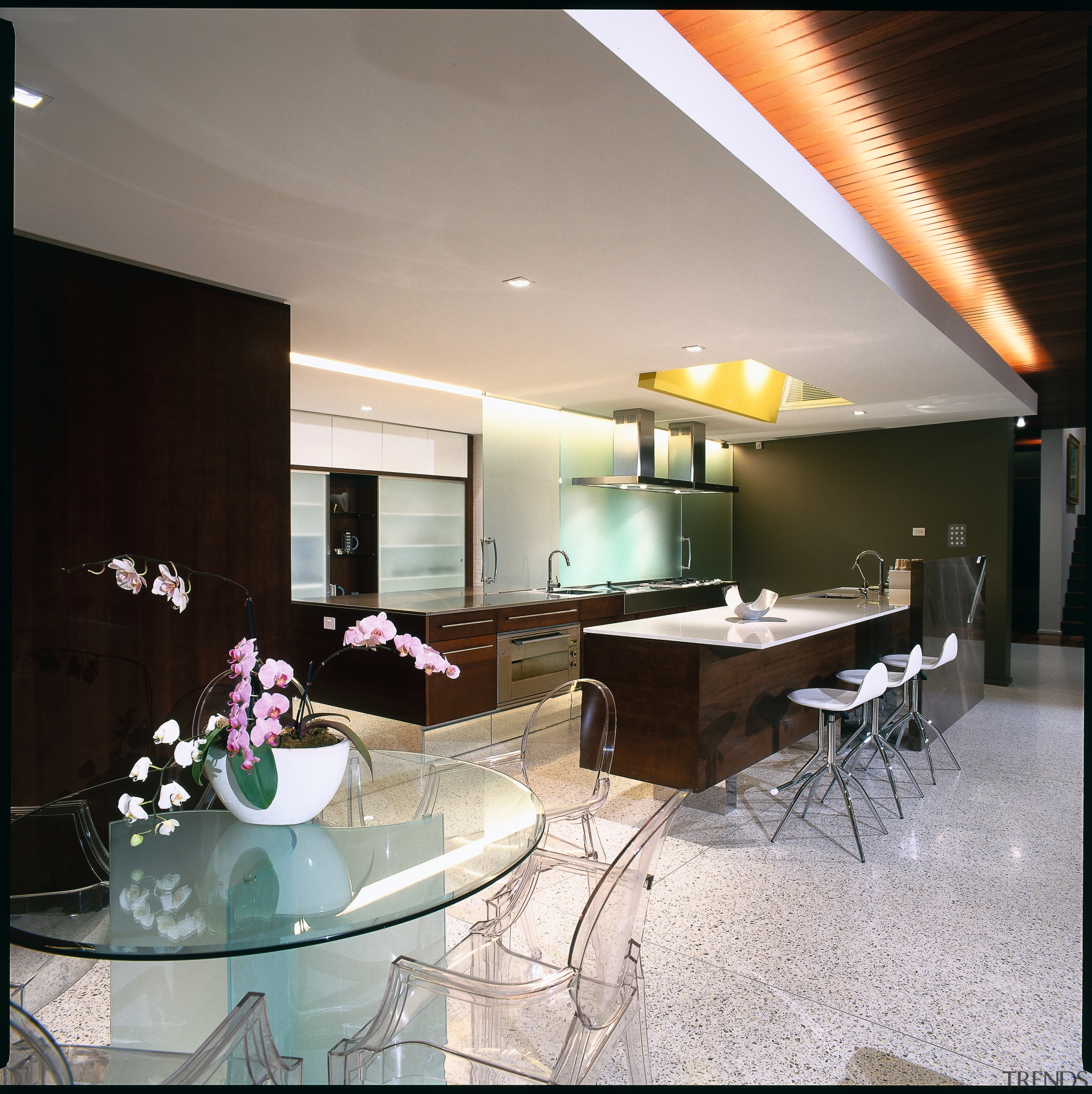 view of the kitchen and dining area showing architecture, ceiling, house, interior design, real estate, table, gray, black