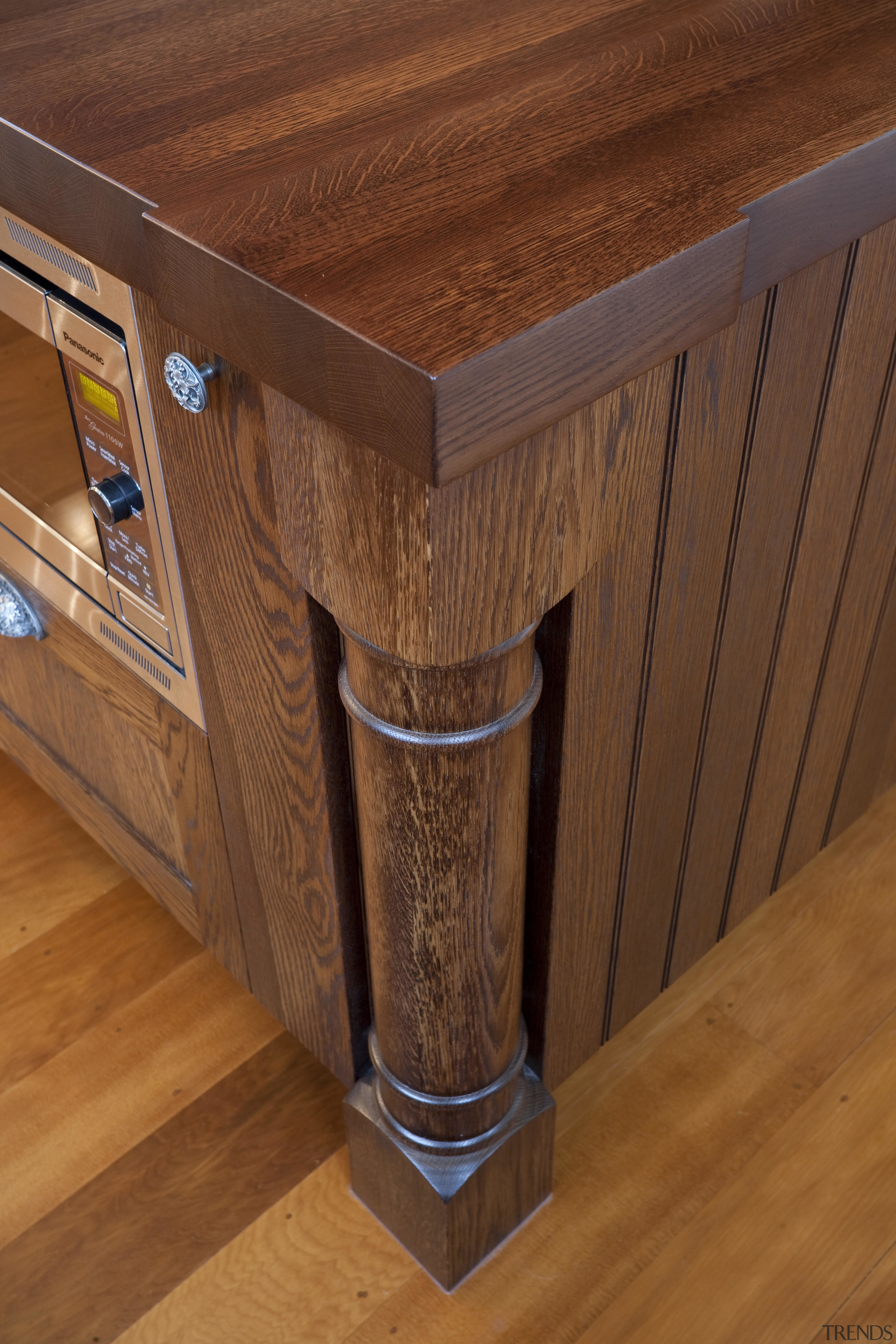 View of a kitchen designed by Nicola Cumming angle, cabinetry, countertop, drawer, floor, flooring, furniture, hardwood, table, wood, wood flooring, wood stain, brown