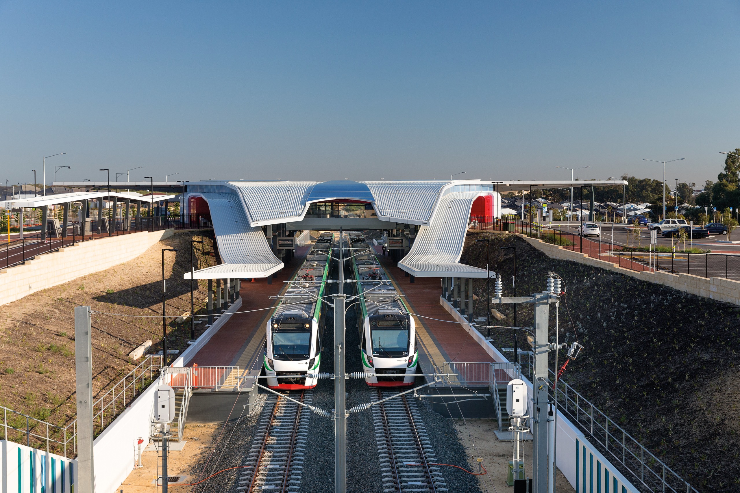 New Butler Railway Station in Perth forms two car, public transport, sky, transport, vehicle, water, waterway, teal, black