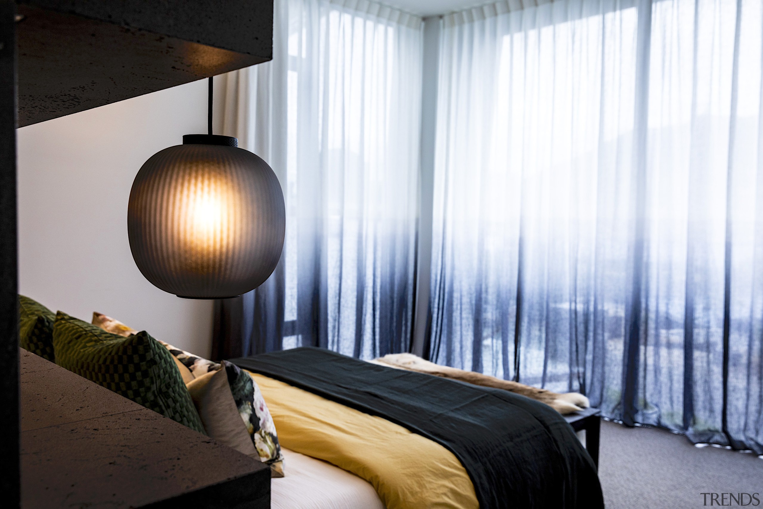 Diaphanous curtains add a soft design touch. 