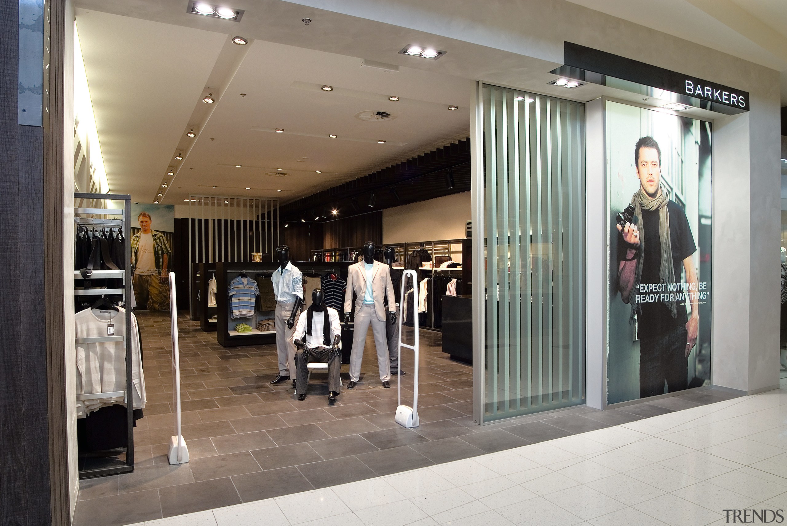 A view of a shop designed by Adrian boutique, interior design, retail, shopping mall, gray