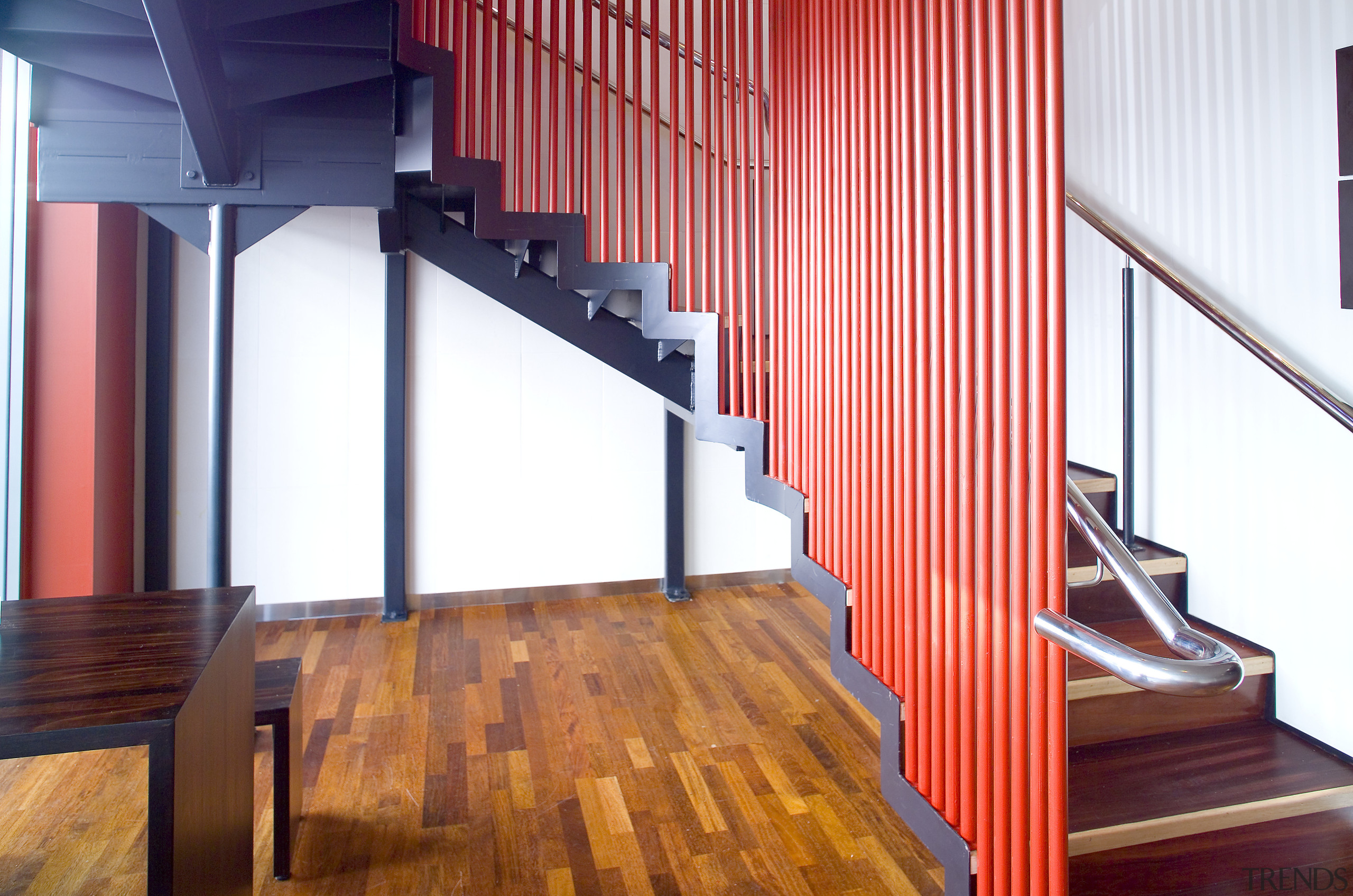 A view of a staircase by Jamar Industries. architecture, ceiling, floor, flooring, hardwood, house, interior design, laminate flooring, loft, stairs, structure, wall, wood, wood flooring, white, red