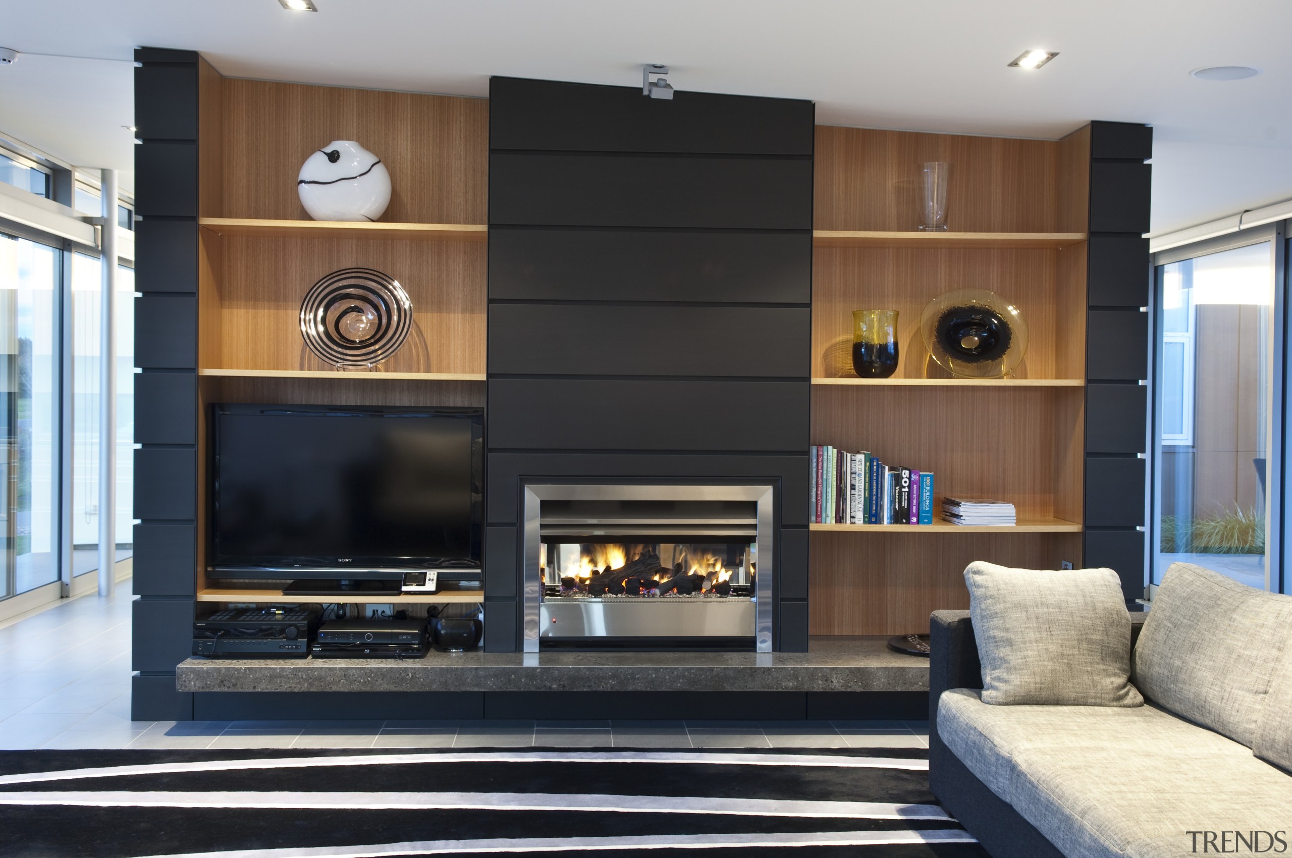 View of dark-toned indoor fireplace. - View of fireplace, hearth, interior design, living room, black