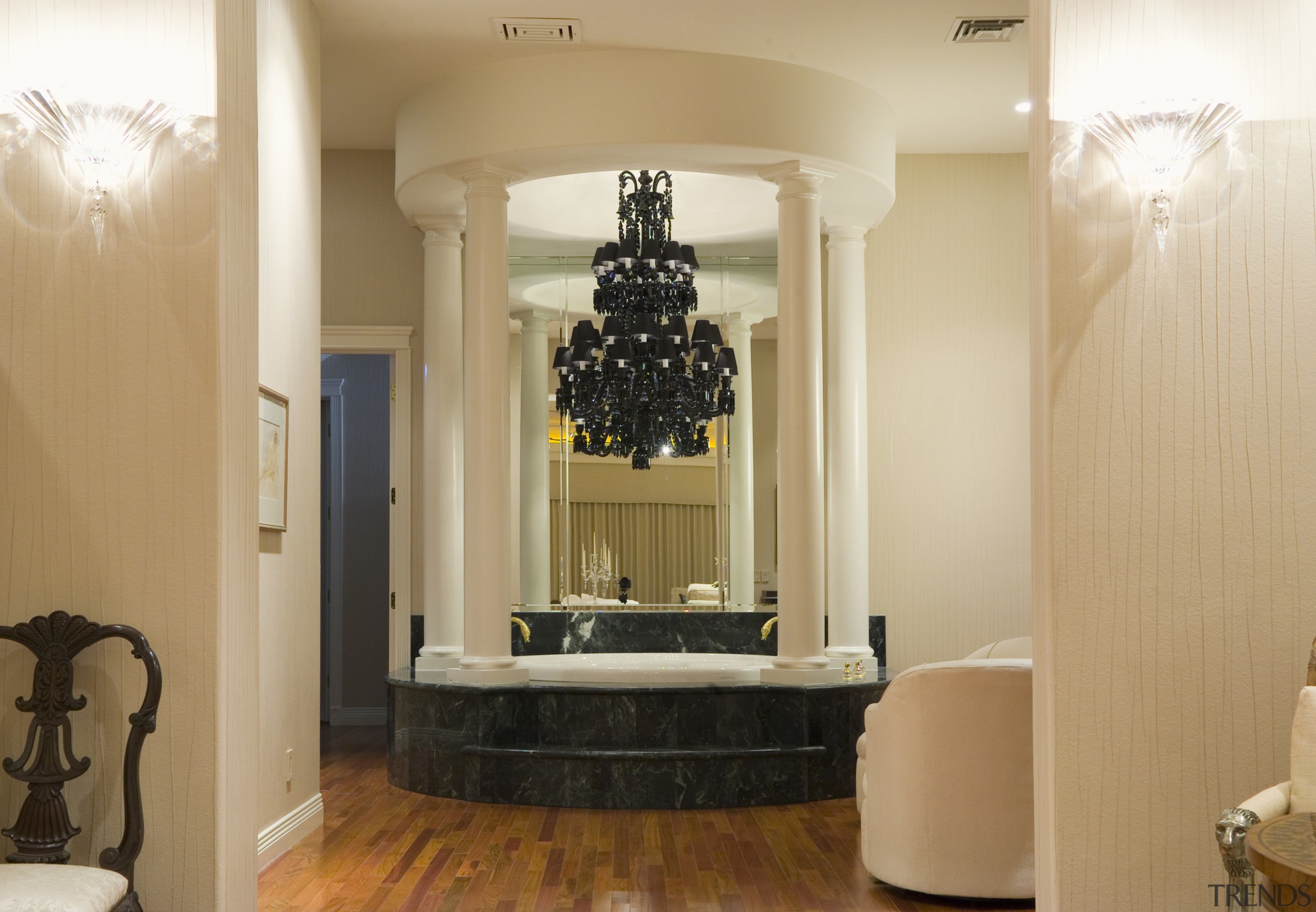 A view of the Wall coverings used in ceiling, floor, flooring, furniture, home, interior design, light fixture, lighting, living room, lobby, room, wall, orange