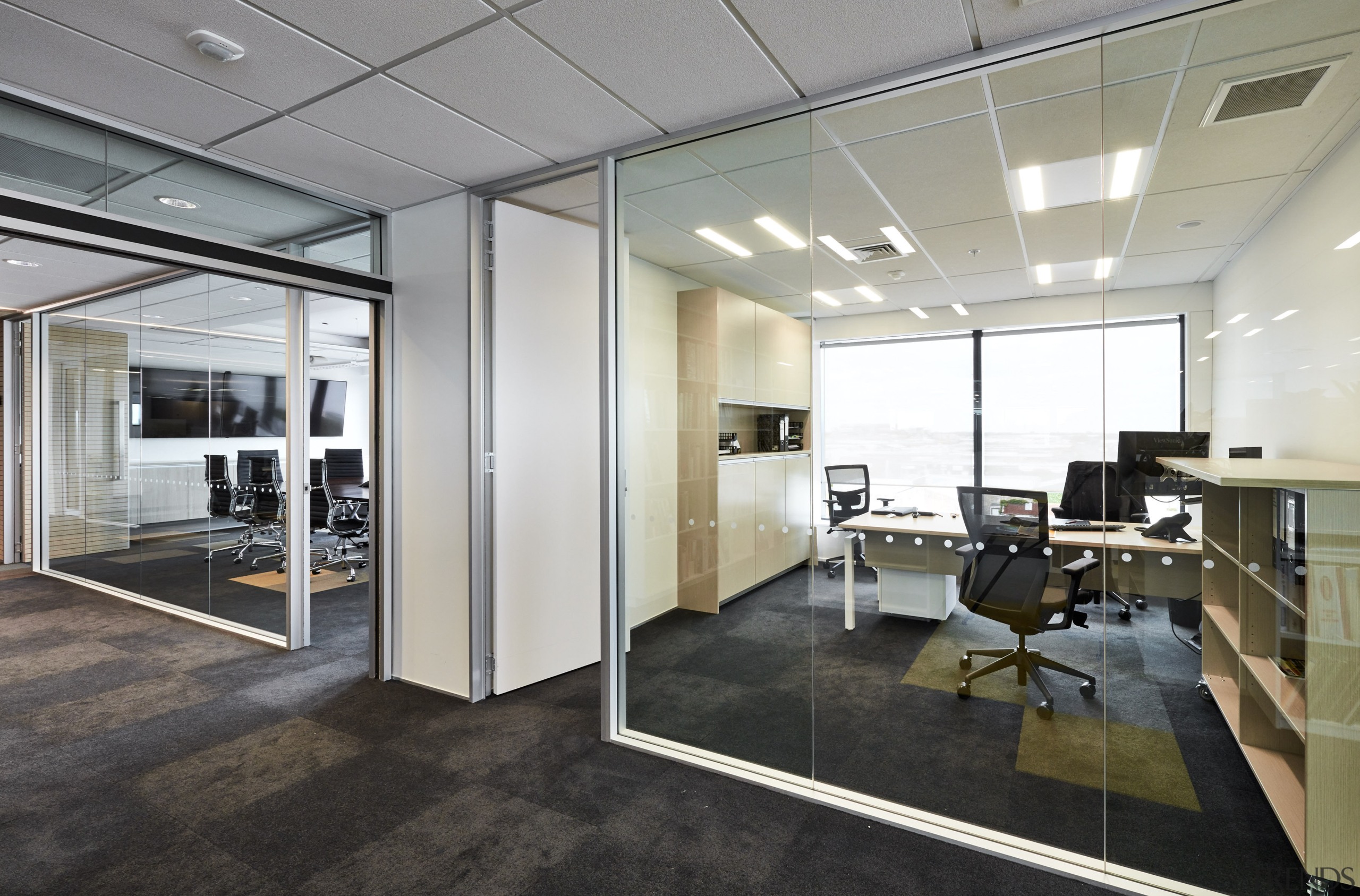 The glass-walled offices at Powell Fenwick House evoke ceiling, floor, flooring, interior design, office, real estate, window, gray, black