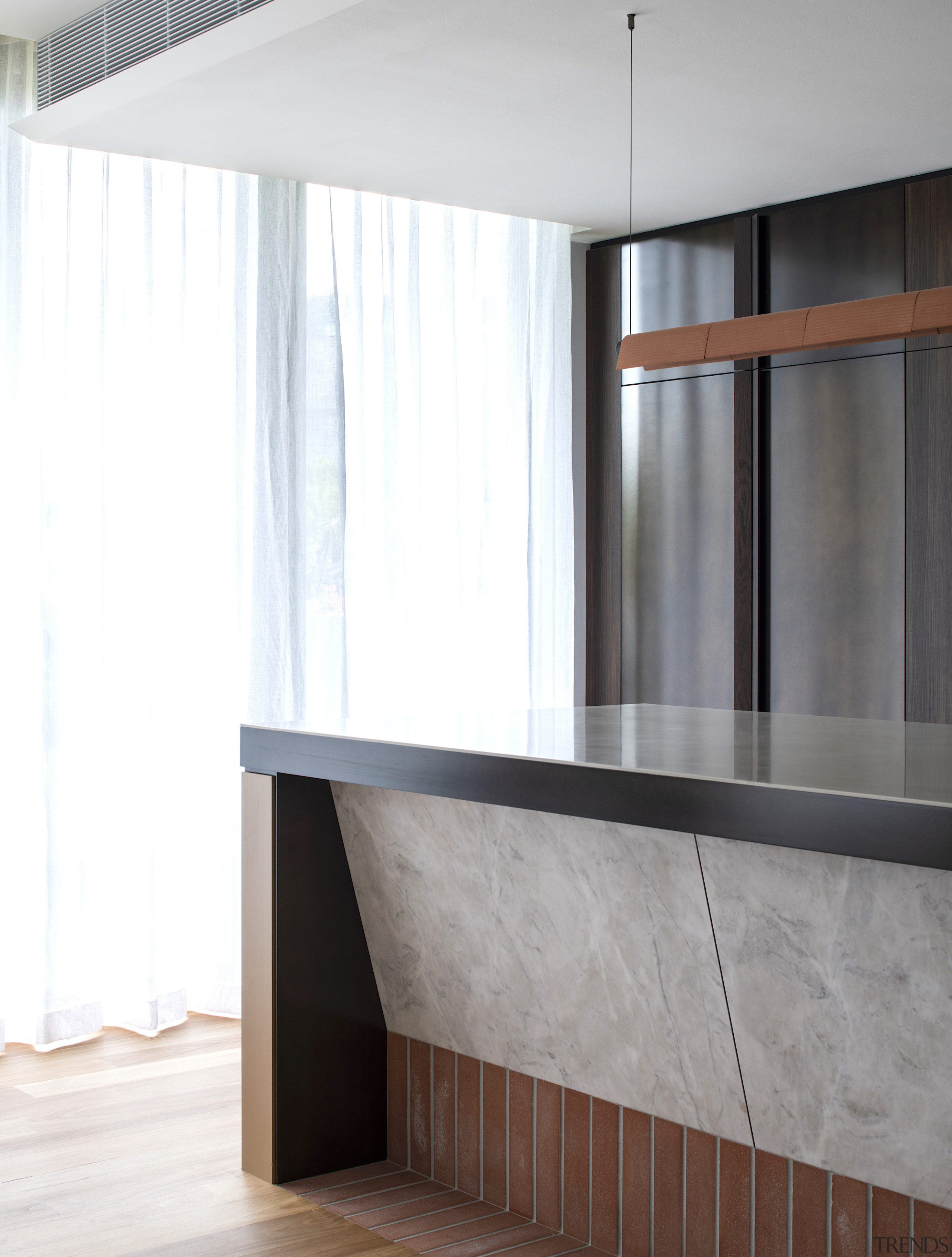 Material choices give the kitchen a sophisticated air, 