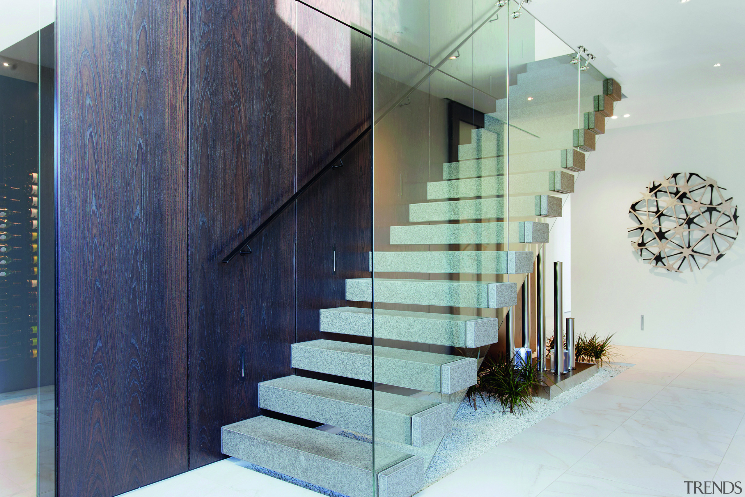 ​​​​​​​The feature staircase in this entry hall is architecture, building, design, staircase, handrail, home, house, interior design, material property, cantilevered stairs, O'Neil Architecture