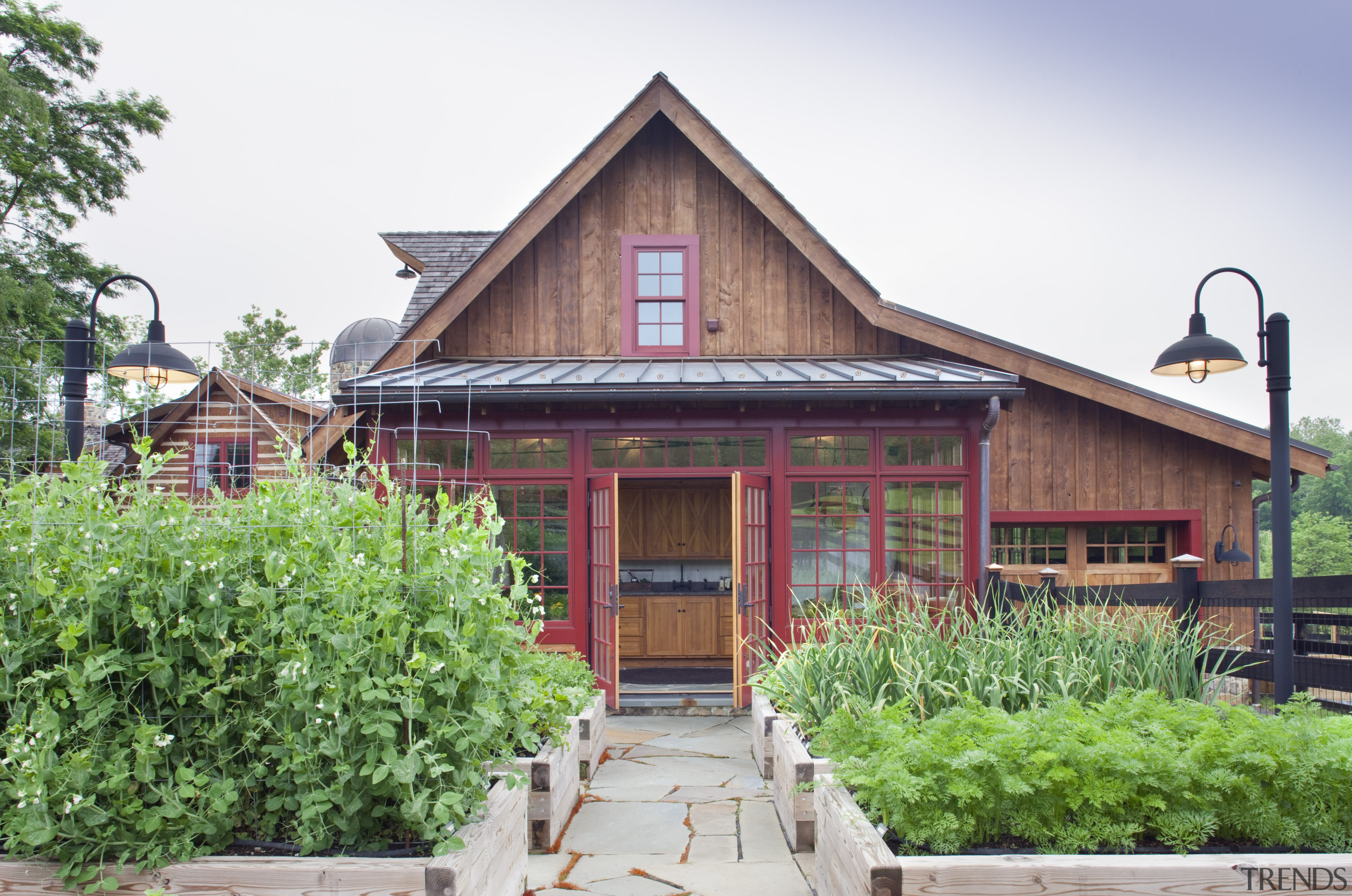 View of wooden home with planter boxes in cottage, estate, facade, farmhouse, home, house, outdoor structure, plant, real estate, tree, white, green