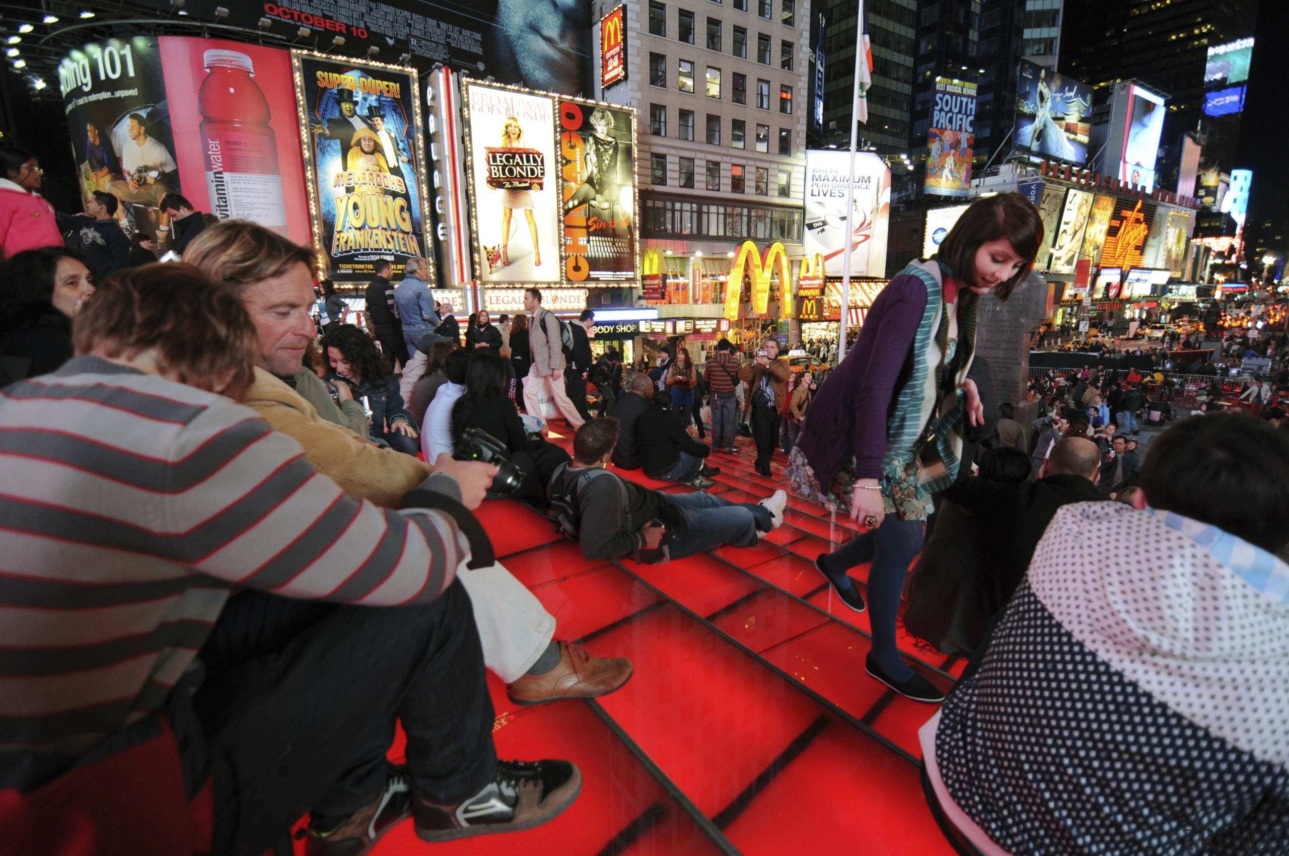 View of the new TKTS ticketing booth in crowd, street, black