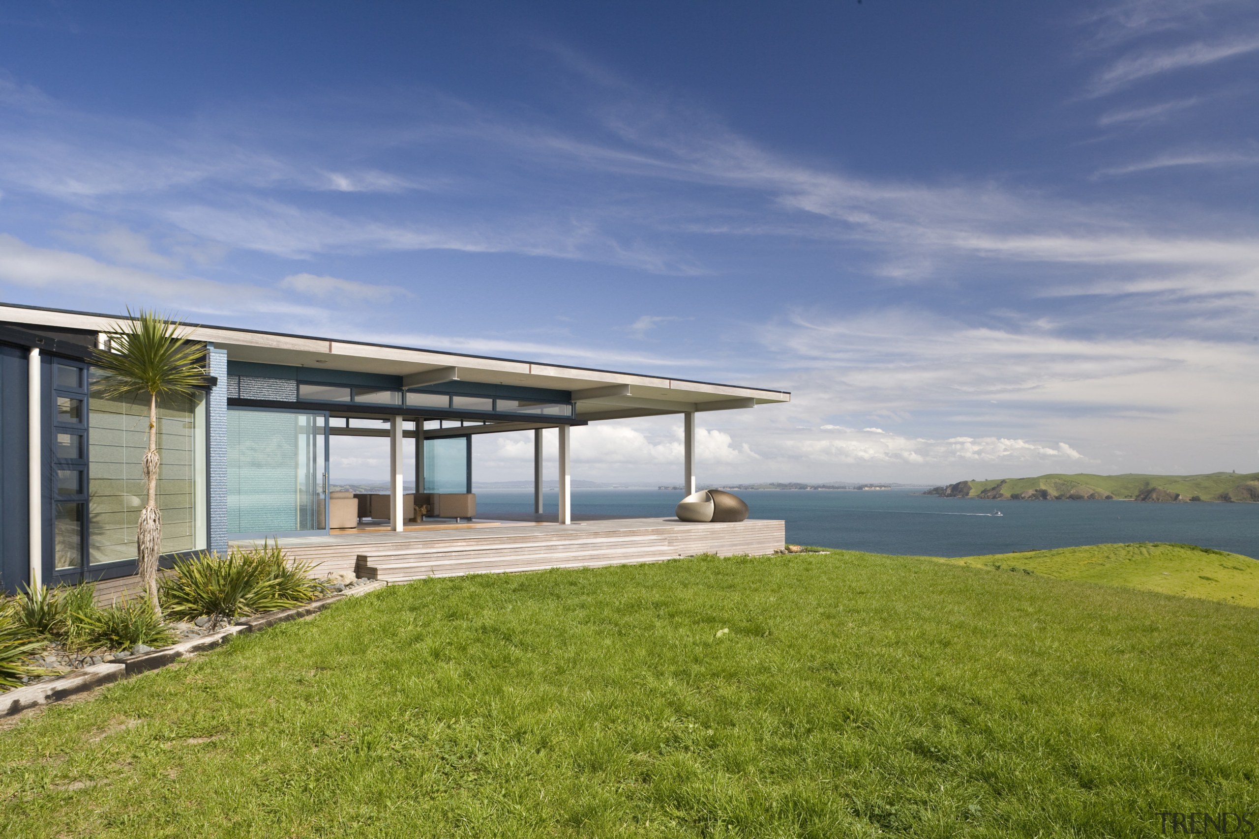 Image of the exterior of this beautifully designed architecture, cloud, cottage, estate, home, house, property, real estate, sea, sky, villa