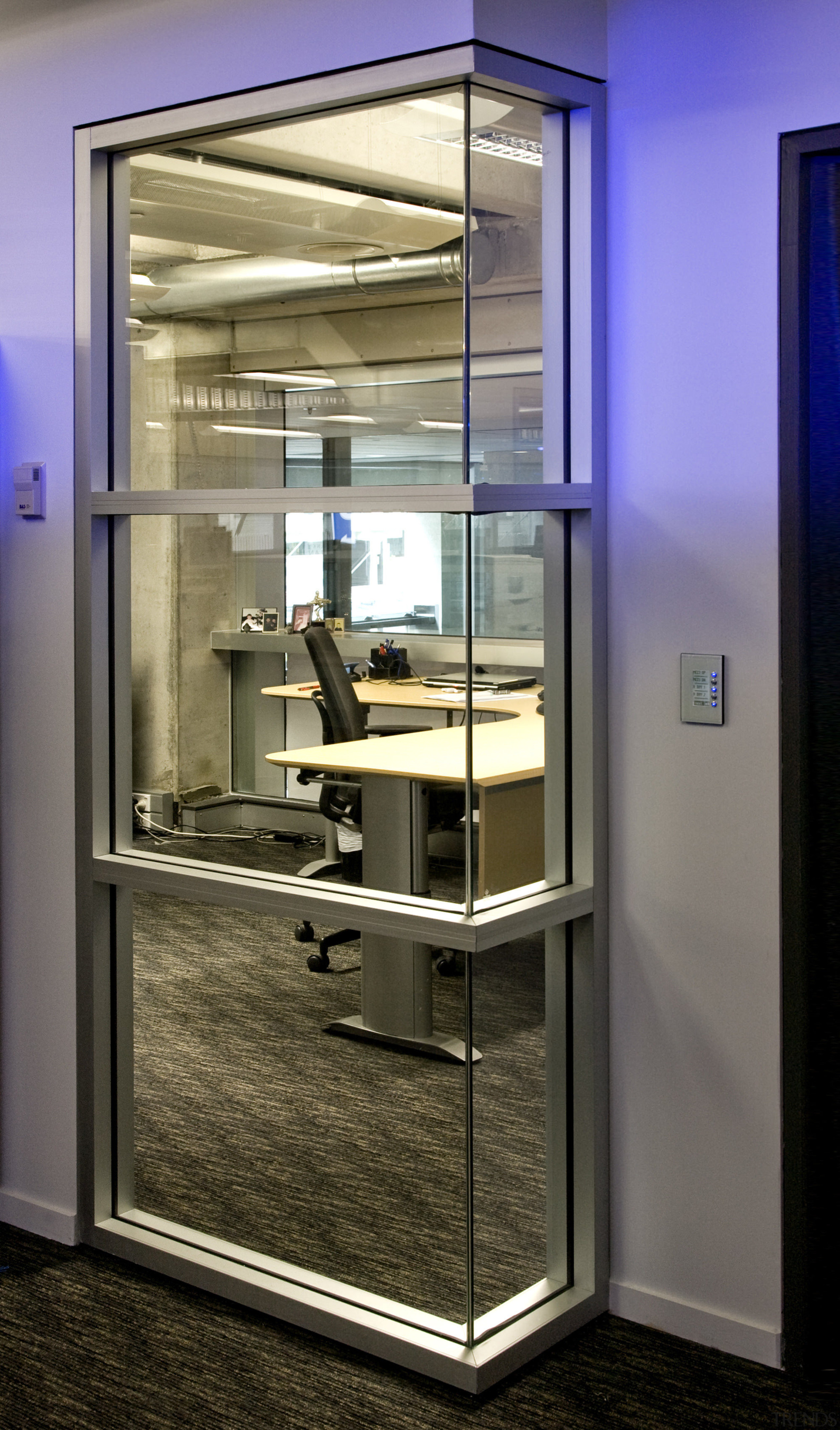 Workstaions on the new mezzanine level feature ergonomic, display case, door, glass, window, brown