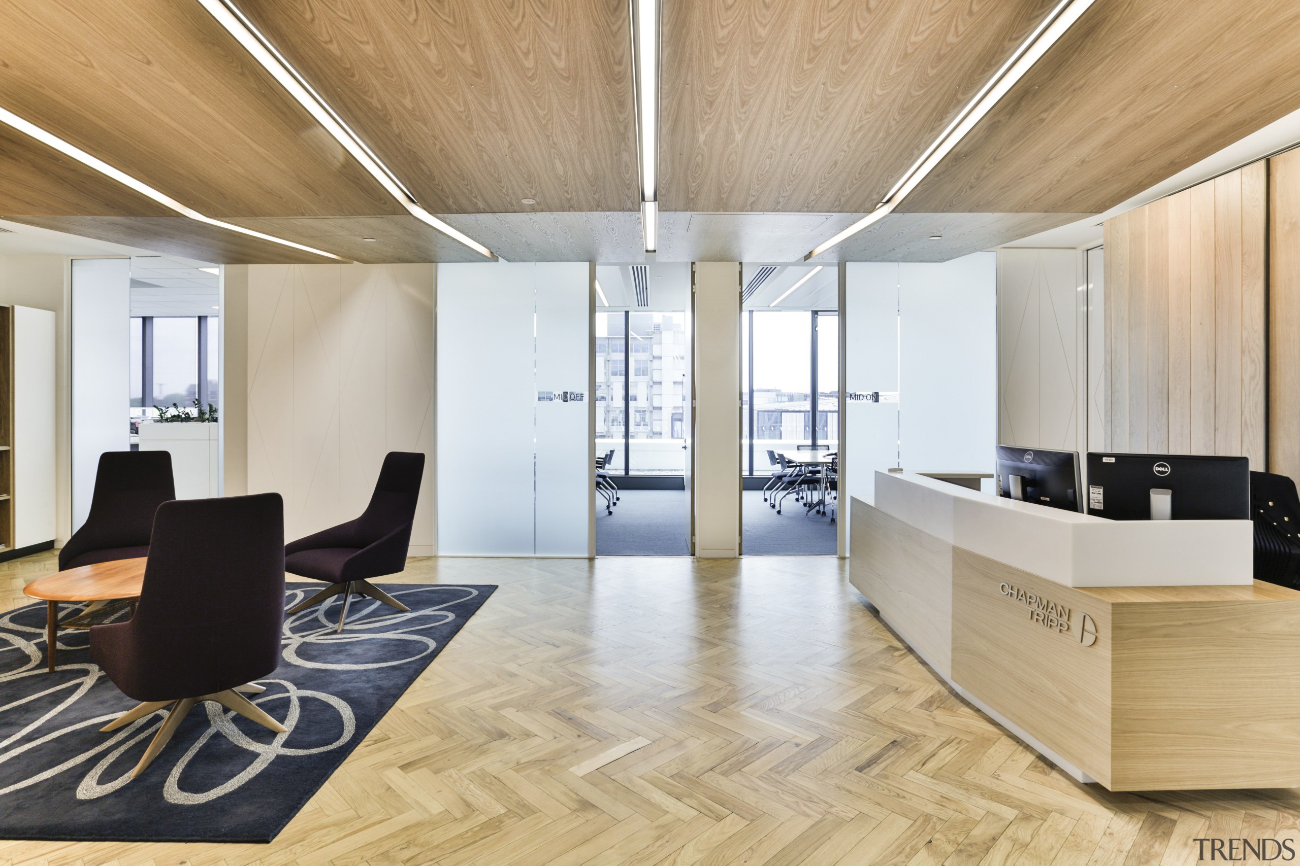 Two Chapman Tripp client meeting rooms lie beyond architecture, ceiling, floor, flooring, furniture, hardwood, interior design, laminate flooring, lobby, office, real estate, wood, wood flooring, orange, gray