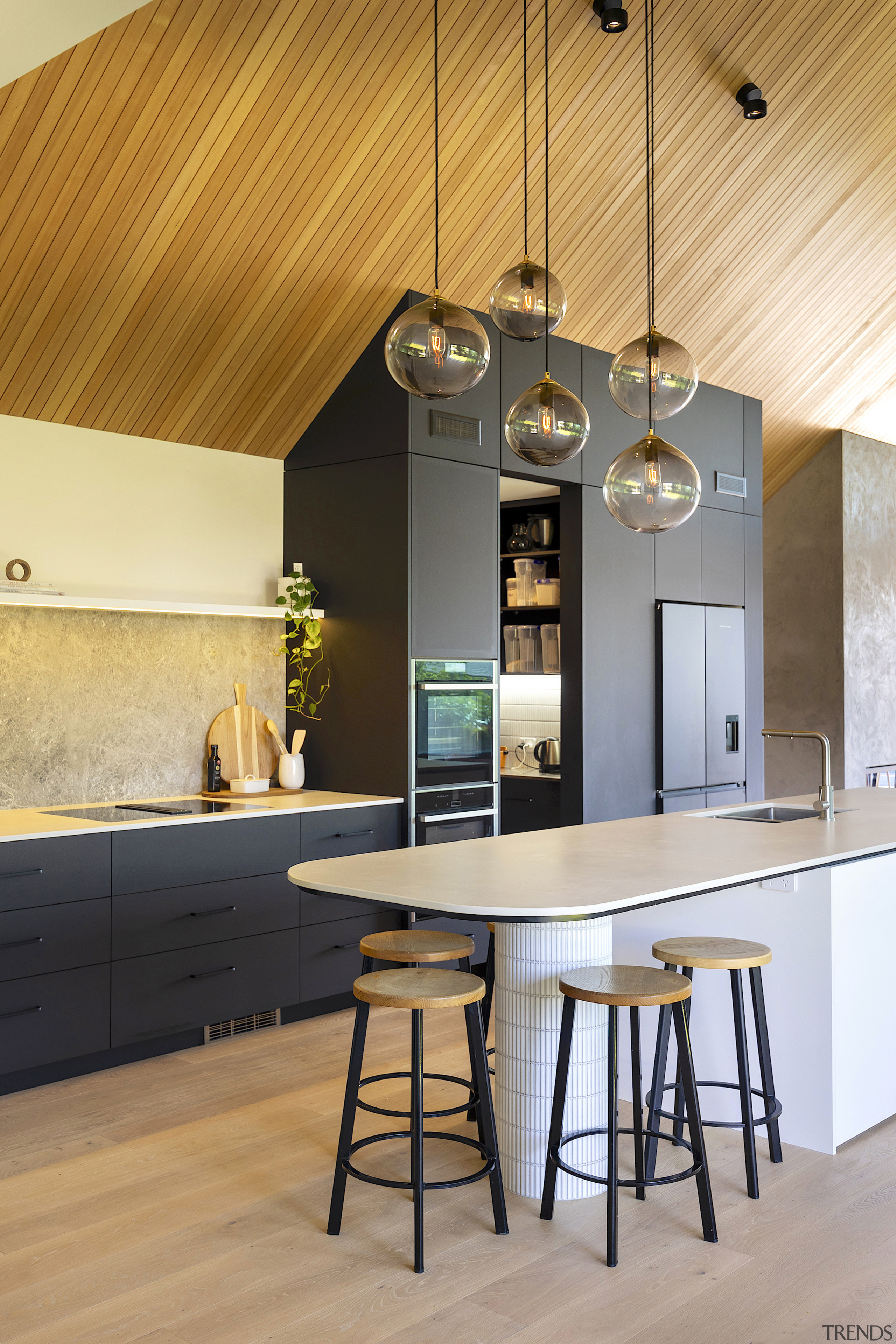 Contemporary pendants draw the eye upwards towards the 