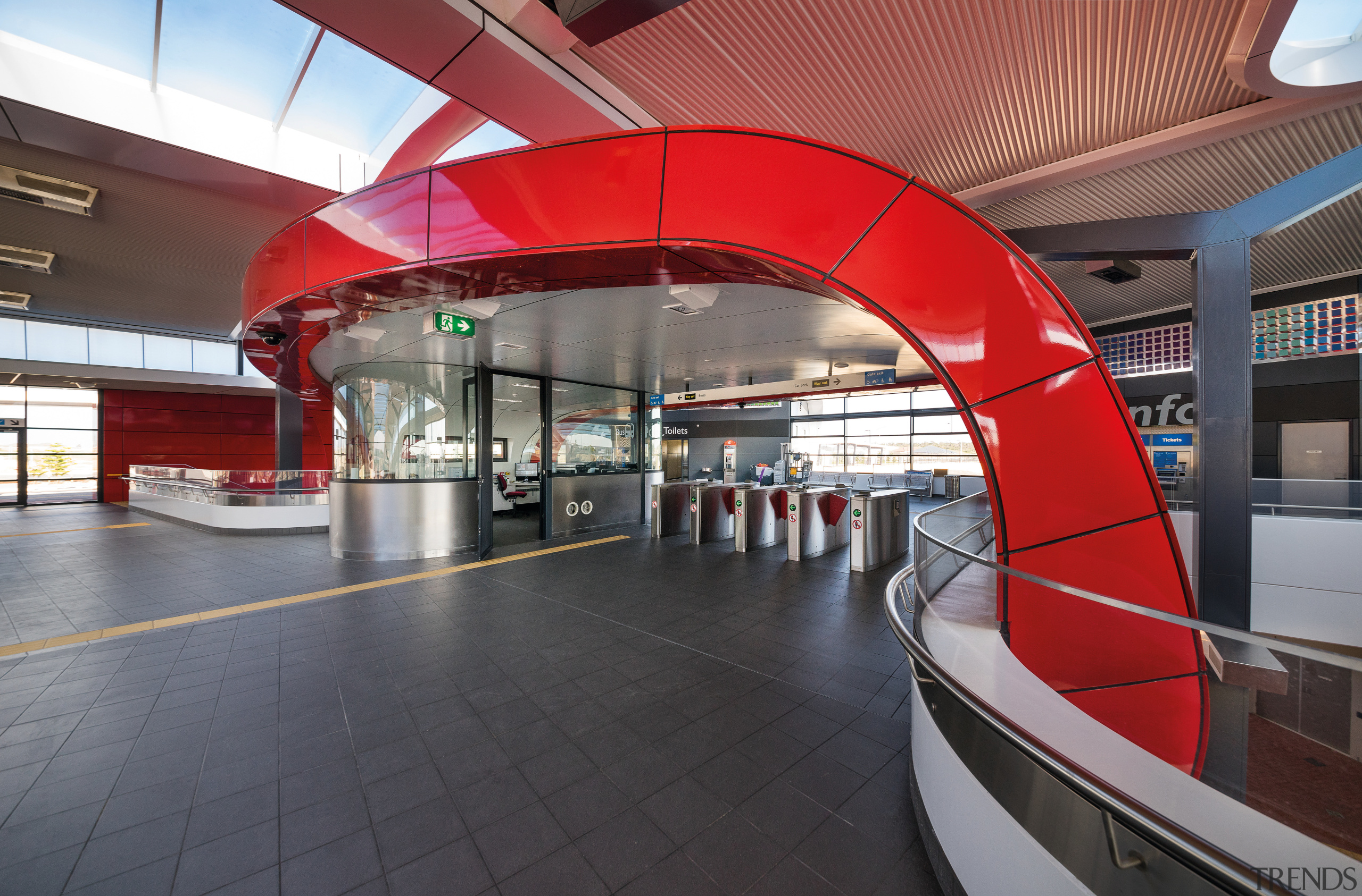 A curved, bright red interior canopy frames the airport terminal, architecture, metropolitan area, public transport, structure, transport, red, gray