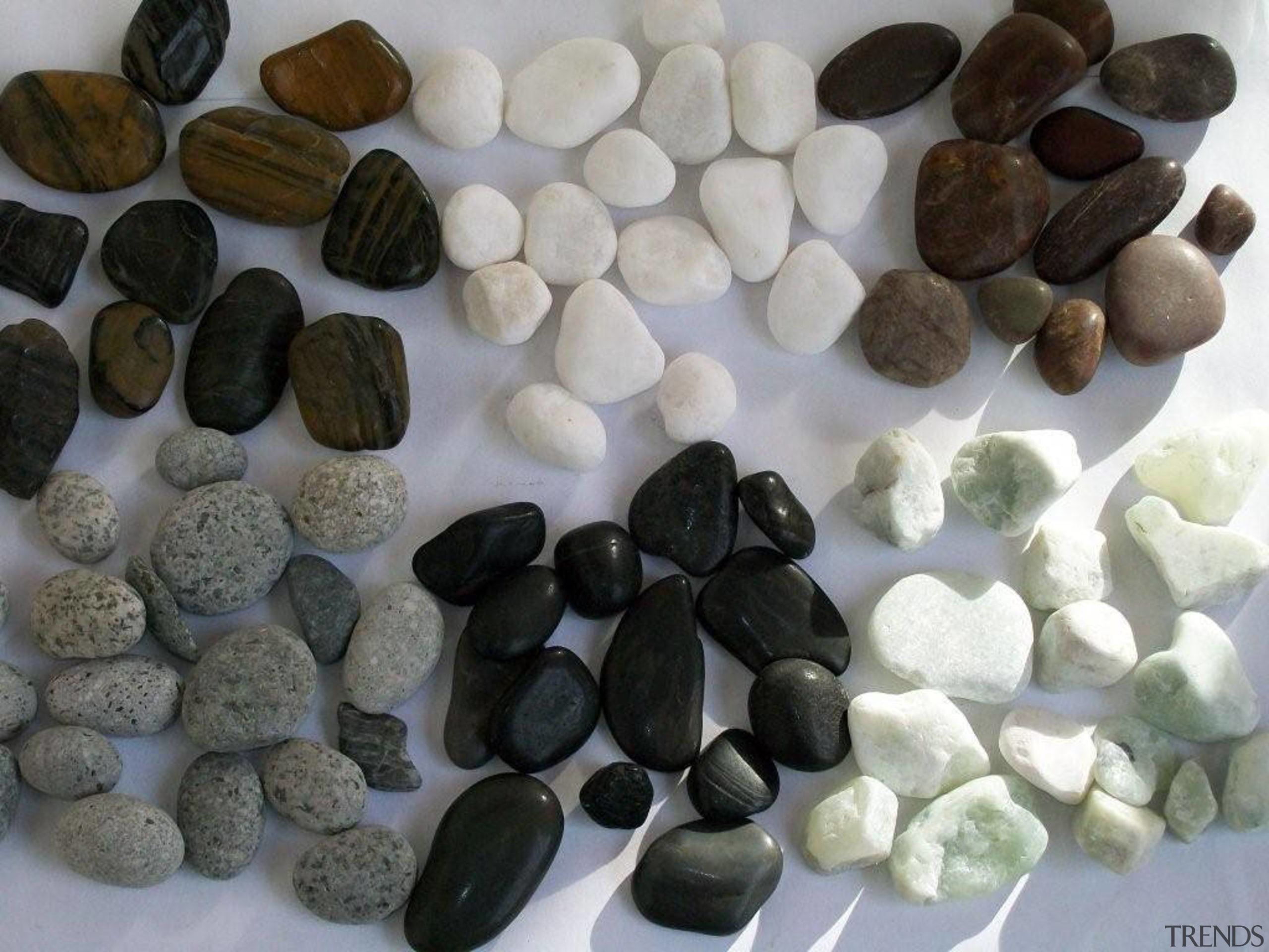 view of concrete flooring with exposed pebbles available material, pebble, rock, gray, black