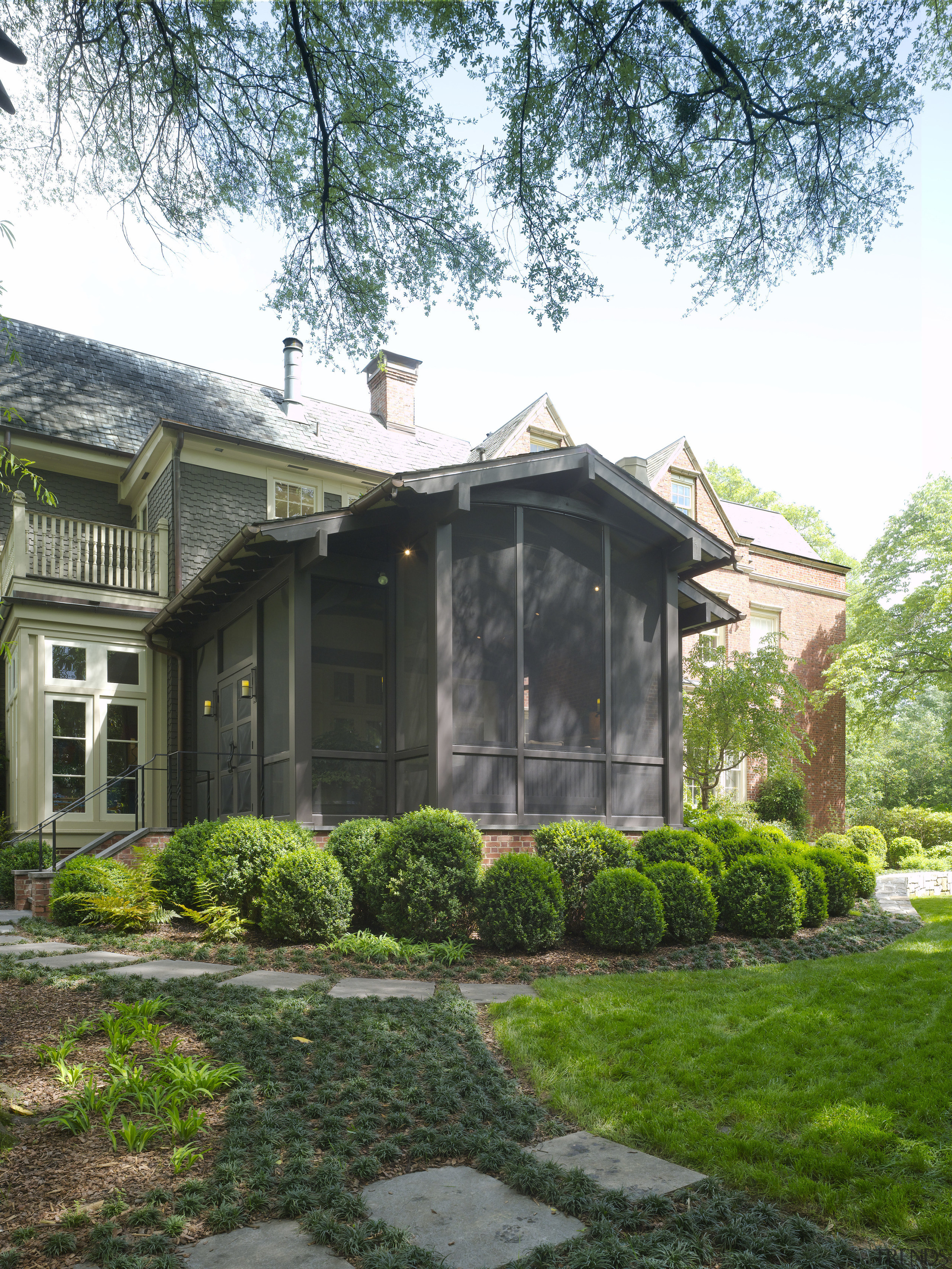 Exterior view of this traditional entrance way - backyard, cottage, estate, farmhouse, garden, historic house, home, house, landscape, landscaping, outdoor structure, property, real estate, siding, tree, yard, white