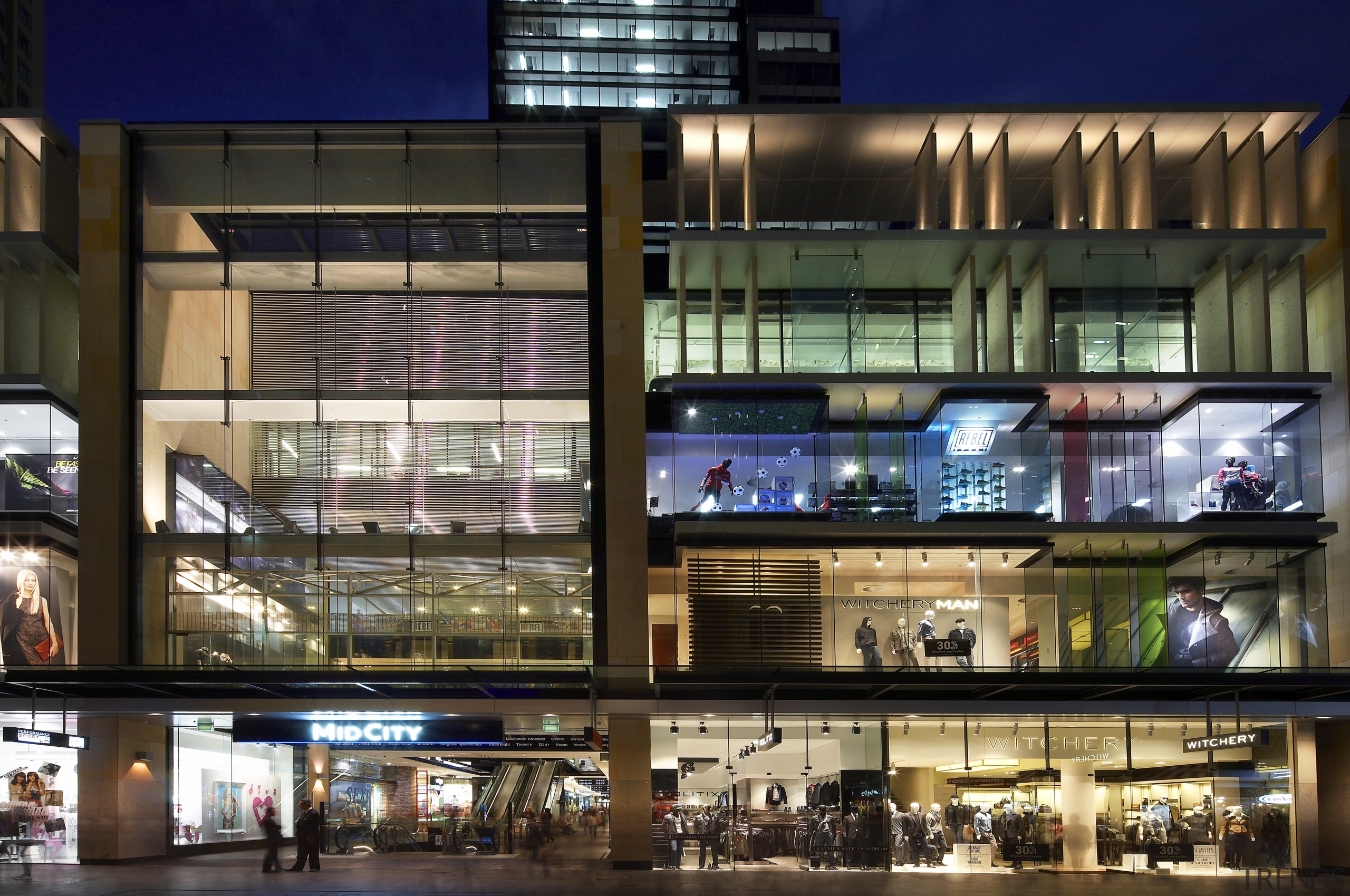 Exterior night shot of 420 George Street, featuring building, facade, mixed use, night, brown, black