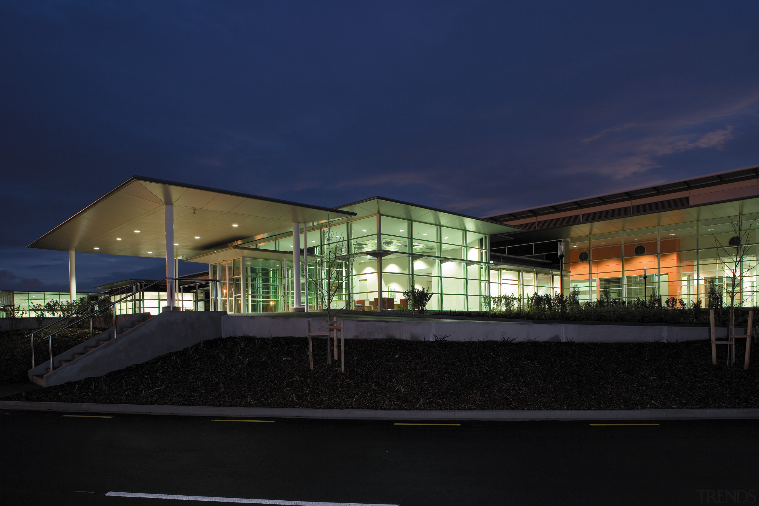 An exterior view of the enitre Fiaher &amp; architecture, building, corporate headquarters, daylighting, estate, evening, facade, headquarters, home, house, lighting, mixed use, night, real estate, reflection, residential area, sky, black, blue
