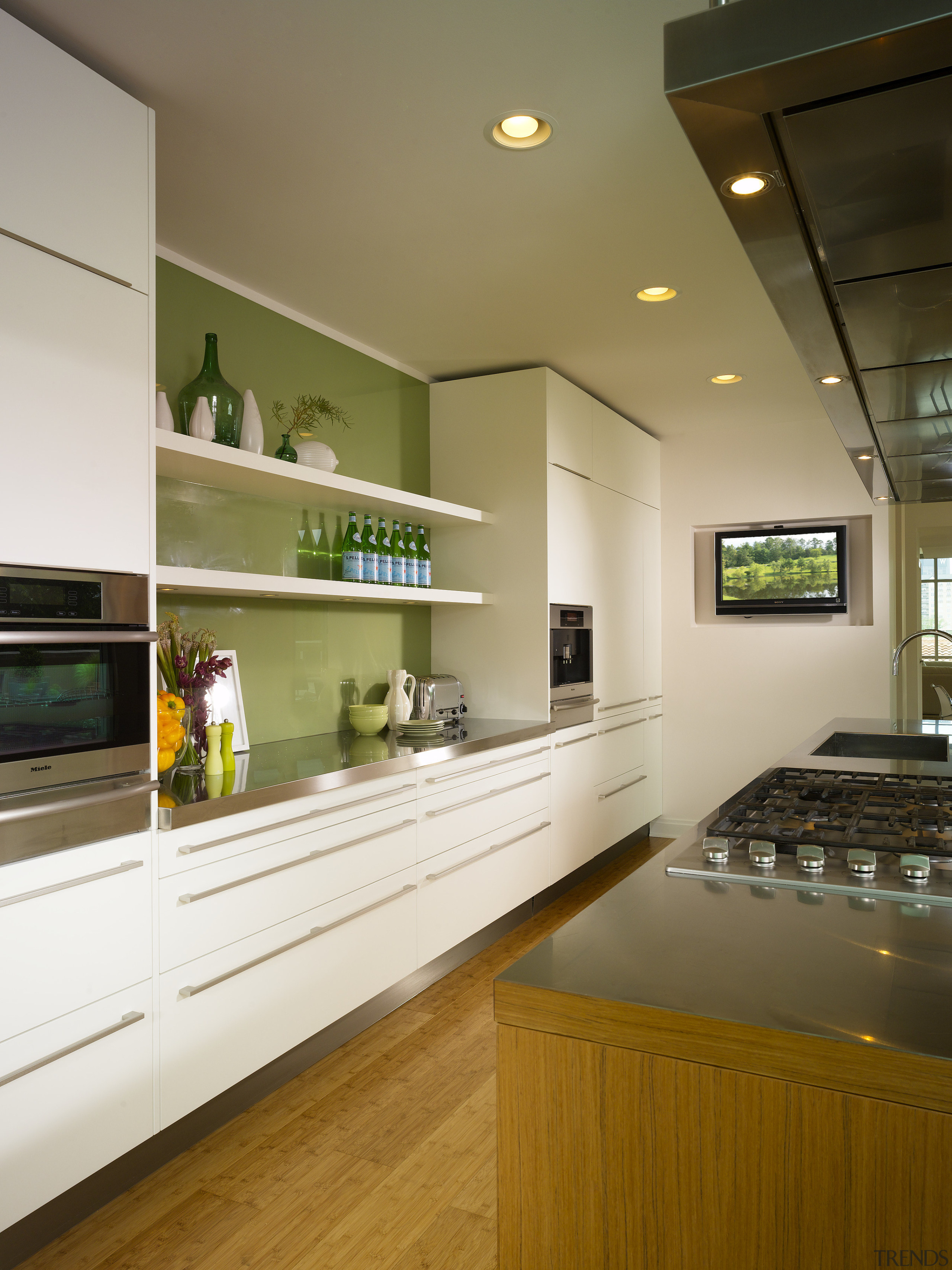 View of a kitchen which features a large cabinetry, countertop, interior design, kitchen, room, brown, white