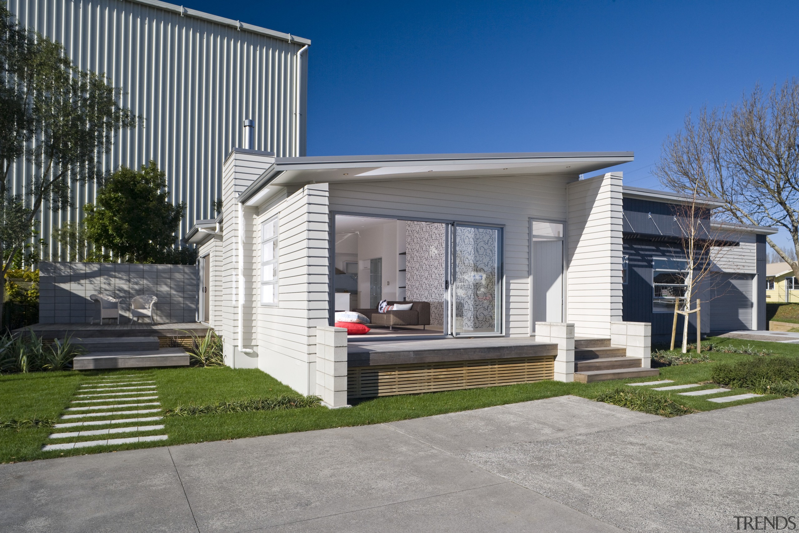 Exterior view of a Harmony Homes show home architecture, building, elevation, facade, home, house, luxury vehicle, property, real estate, residential area, siding, gray