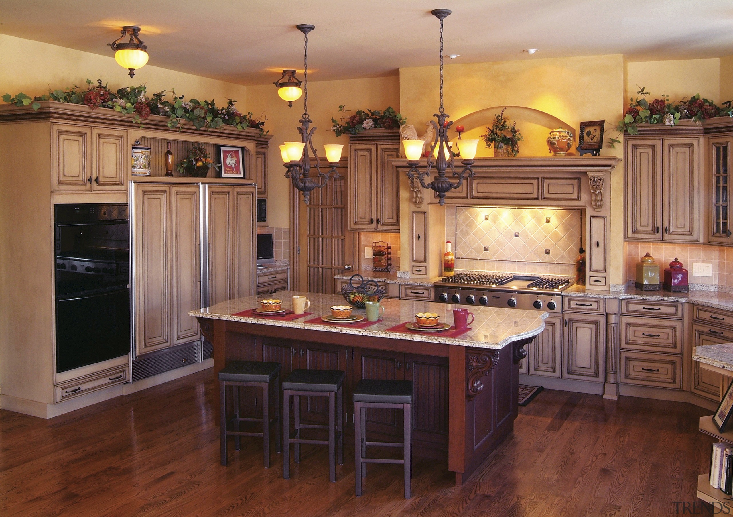 view of kitchen featuring cabinetry, wooden floors, countertops, cabinetry, countertop, cuisine classique, floor, flooring, hardwood, home, interior design, kitchen, room, wood, wood flooring, red, orange