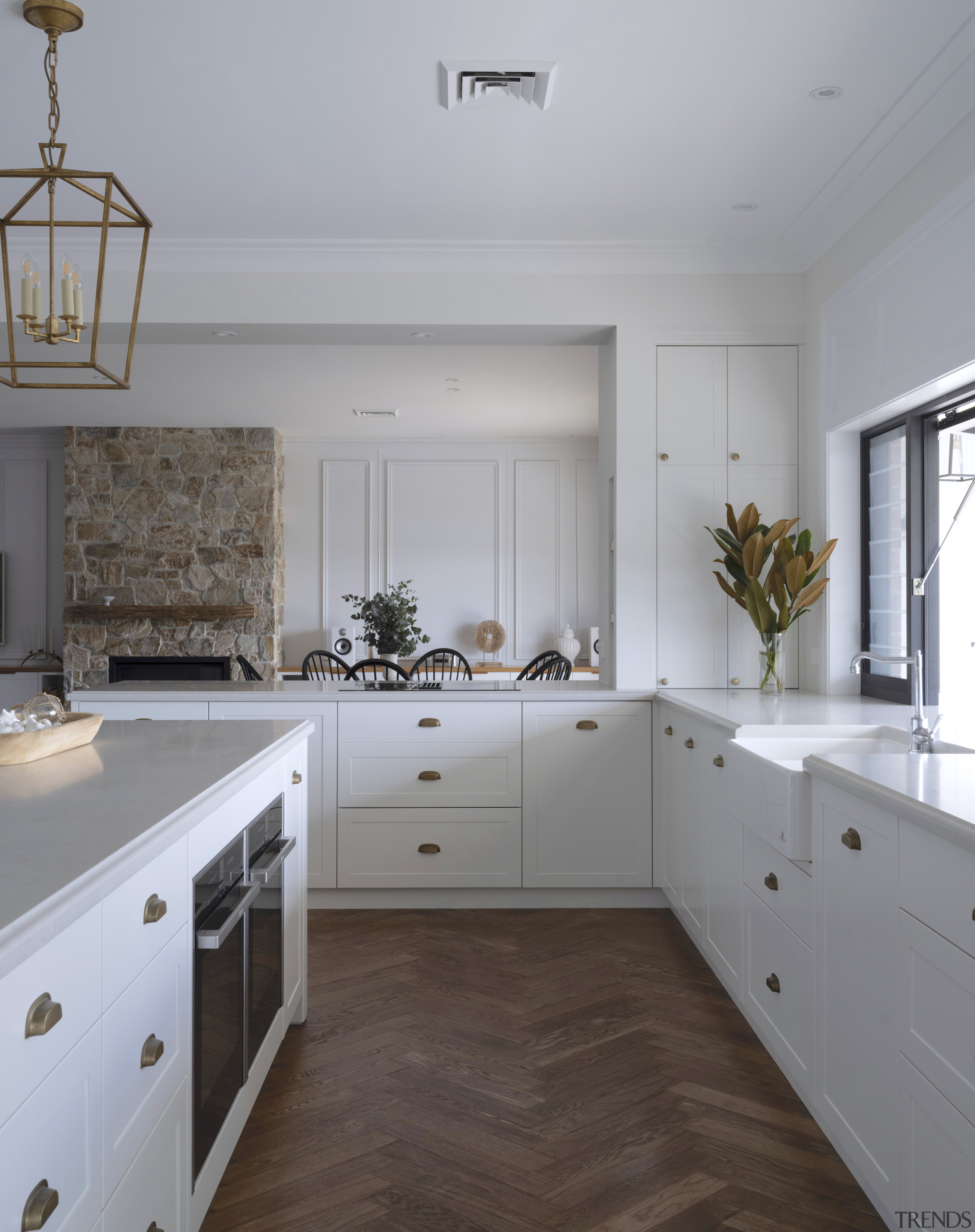 The new kitchen includes classic panelled cabinetry and 