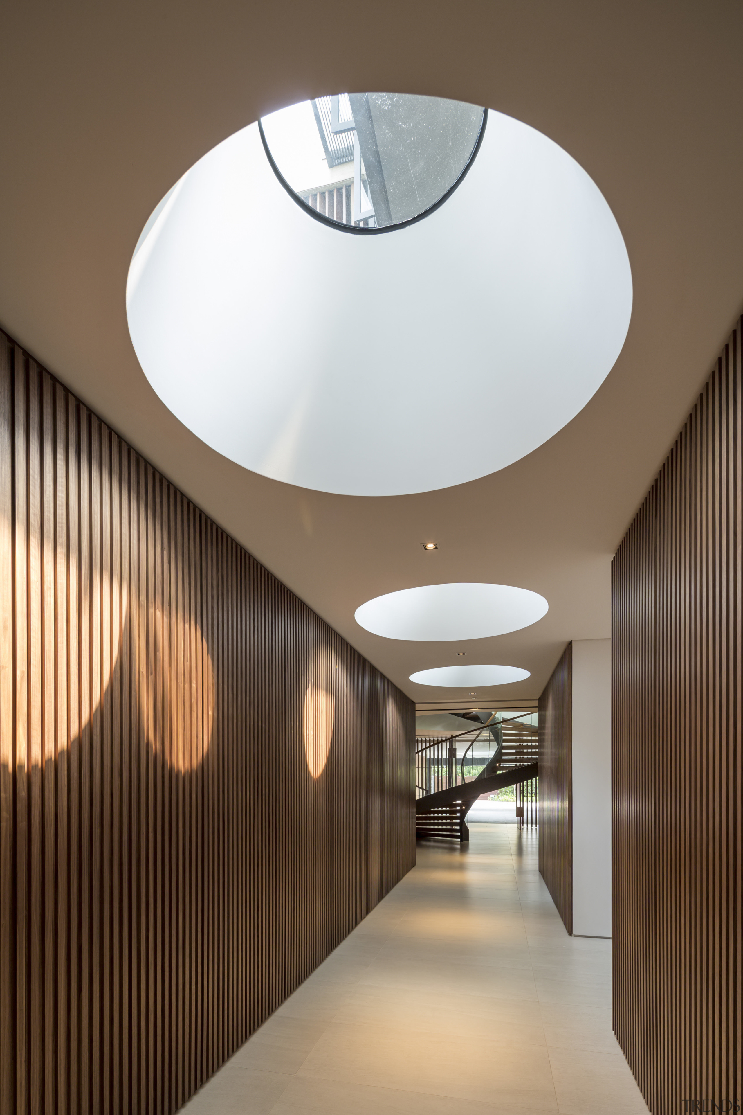 Skylights in this basement level corridor ensure that architecture, ceiling, daylighting, house, interior design, light fixture, lighting, lobby, product design, brown