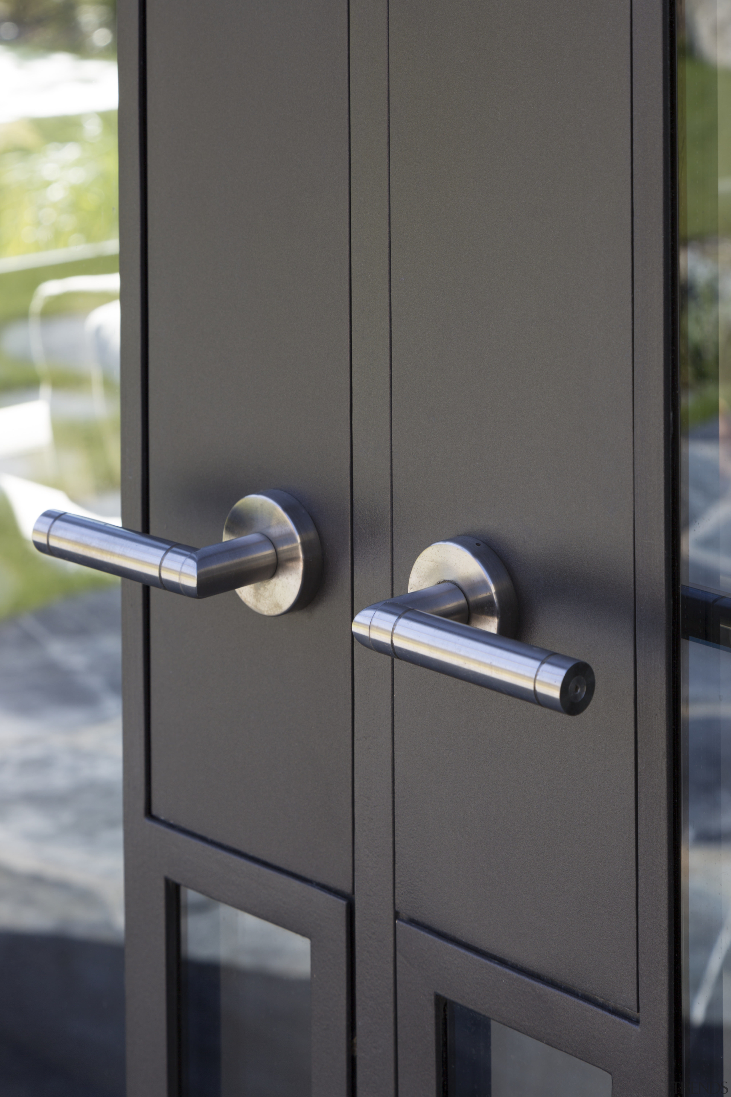 Handles for this Millbrook Resort home were custom-made door, lock, gray