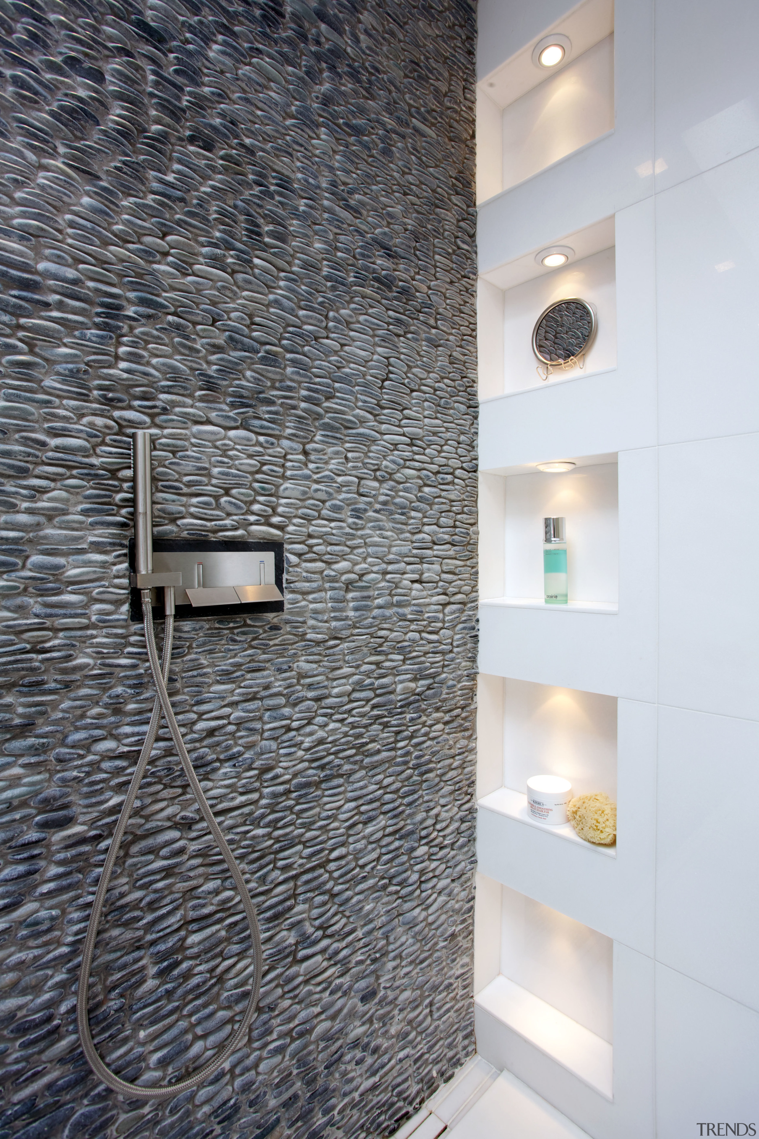 Wall-mounted faucets enhance the streamlined look of this bathroom, ceiling, floor, flooring, interior design, tile, wall, gray, white