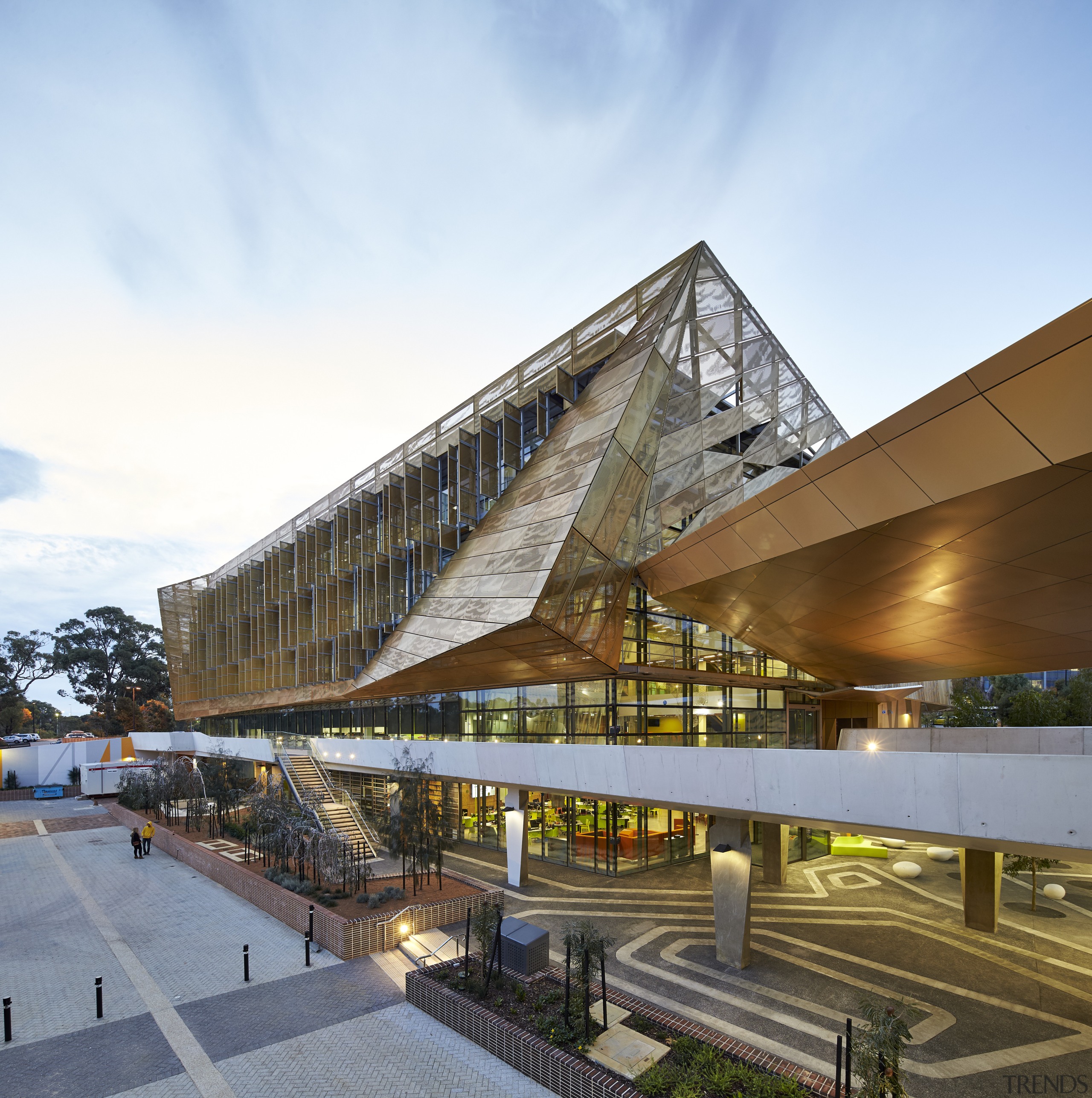 A golden canopy and veil enliven the exterior architecture, building, commercial building, condominium, corporate headquarters, headquarters, mixed use, real estate, sky, white, brown