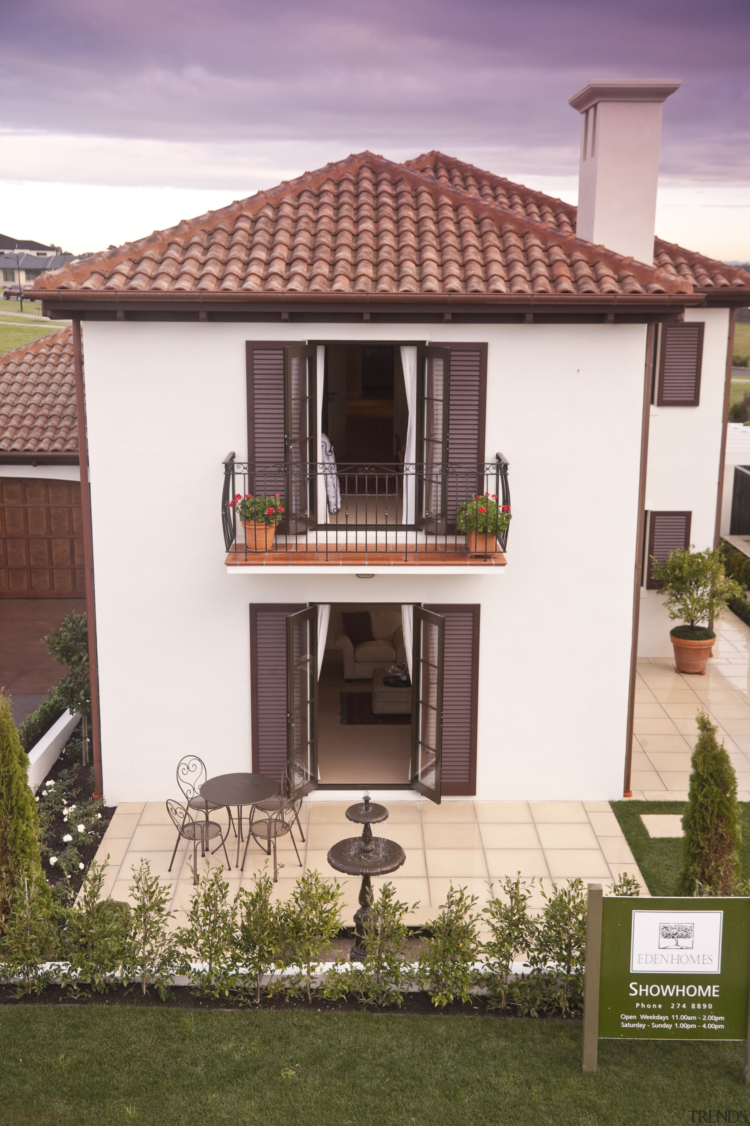 Exterior view of Eden Homes show home which building, elevation, facade, home, house, property, real estate, residential area, roof, villa, white