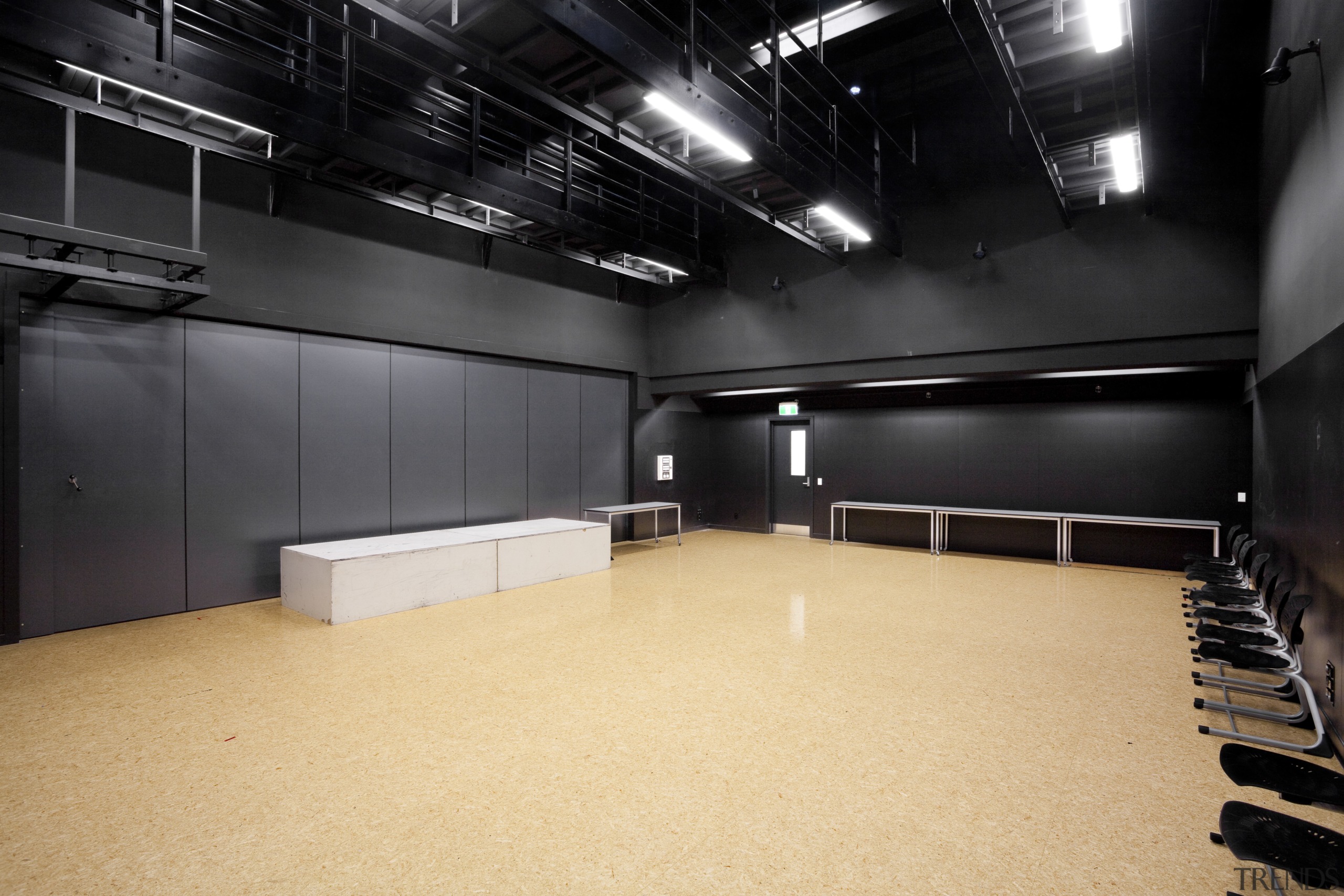 View of room with black walls and ceiling auditorium, ceiling, floor, flooring, interior design, black, orange