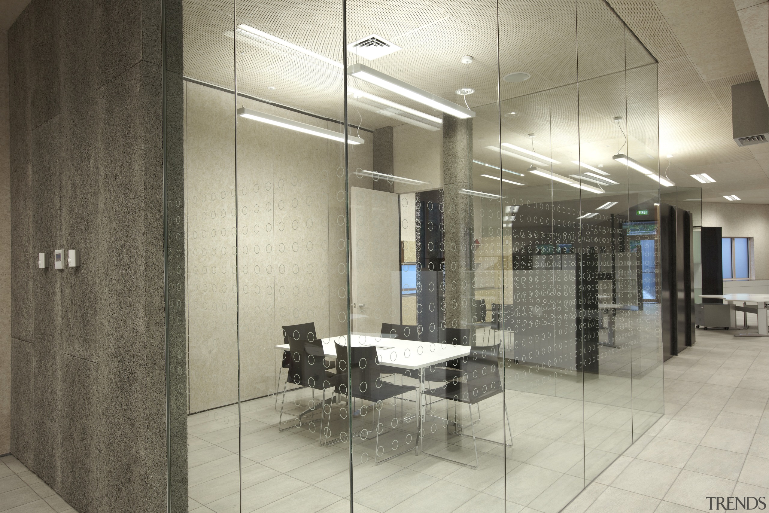 View of DOC building with neutral toned interior ceiling, floor, flooring, glass, interior design, lobby, tile, wall, gray