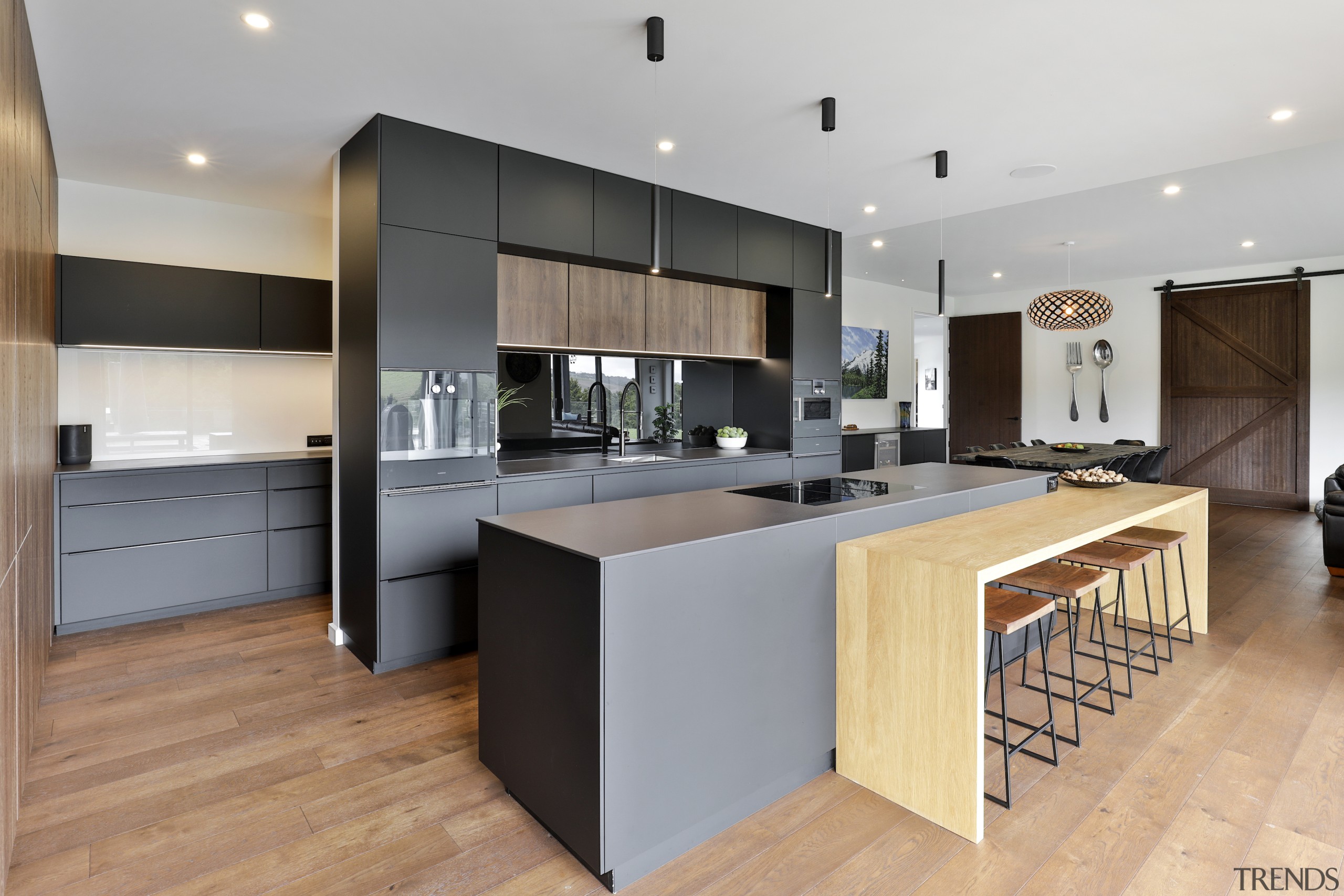 The kitchen's tones and finishes work well with 