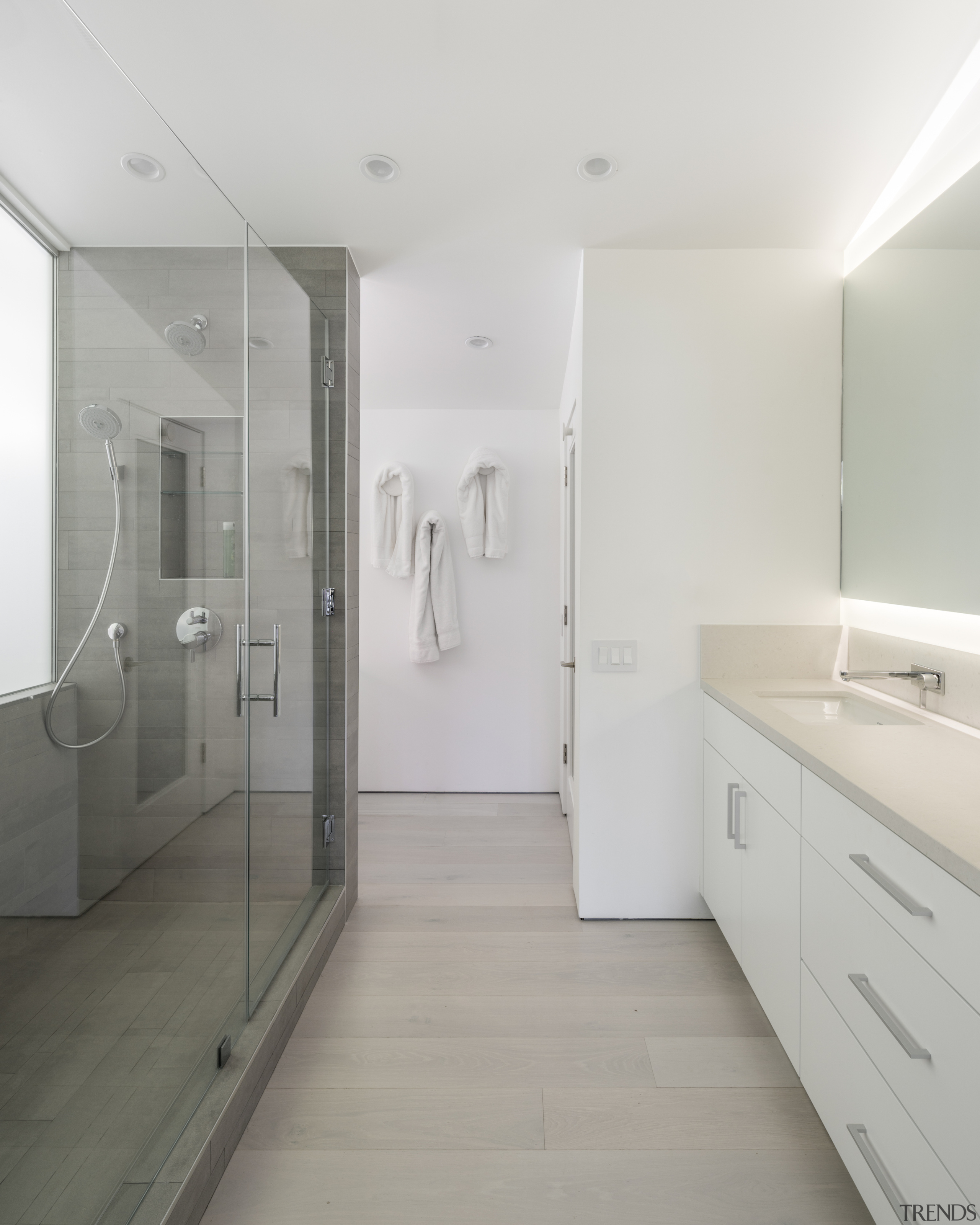 The reinvented homes' long, pale master bathroom. 