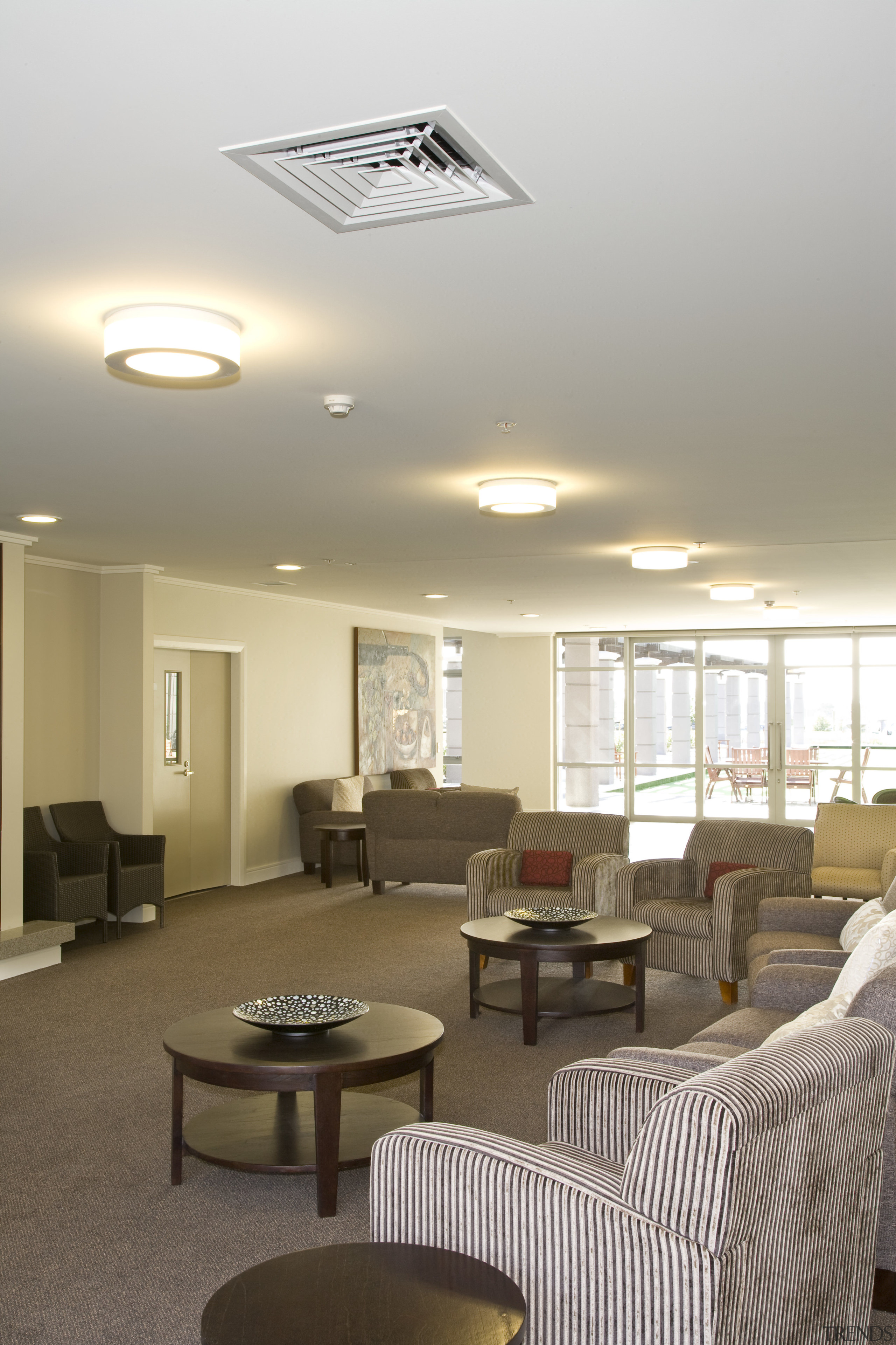 Interior view of one of Summerset's communal areas ceiling, daylighting, interior design, light fixture, lighting, living room, real estate, room, white, brown