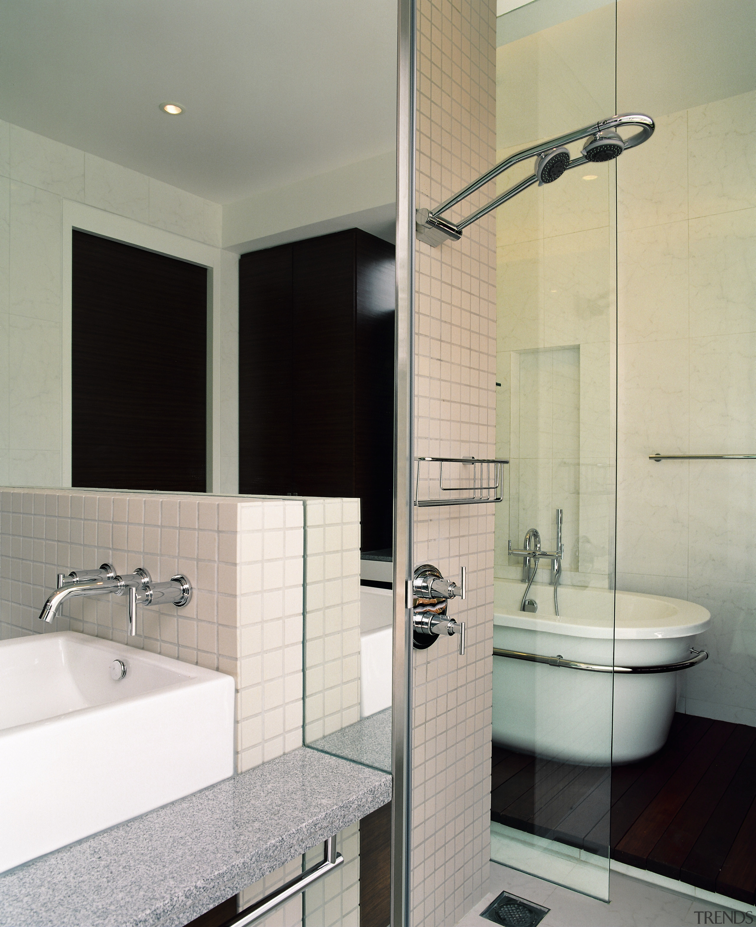 view of the bathroom area showing timber flooring, bathroom, bathroom accessory, bathroom cabinet, floor, glass, interior design, plumbing fixture, product design, room, sink, tap, tile, wall, gray
