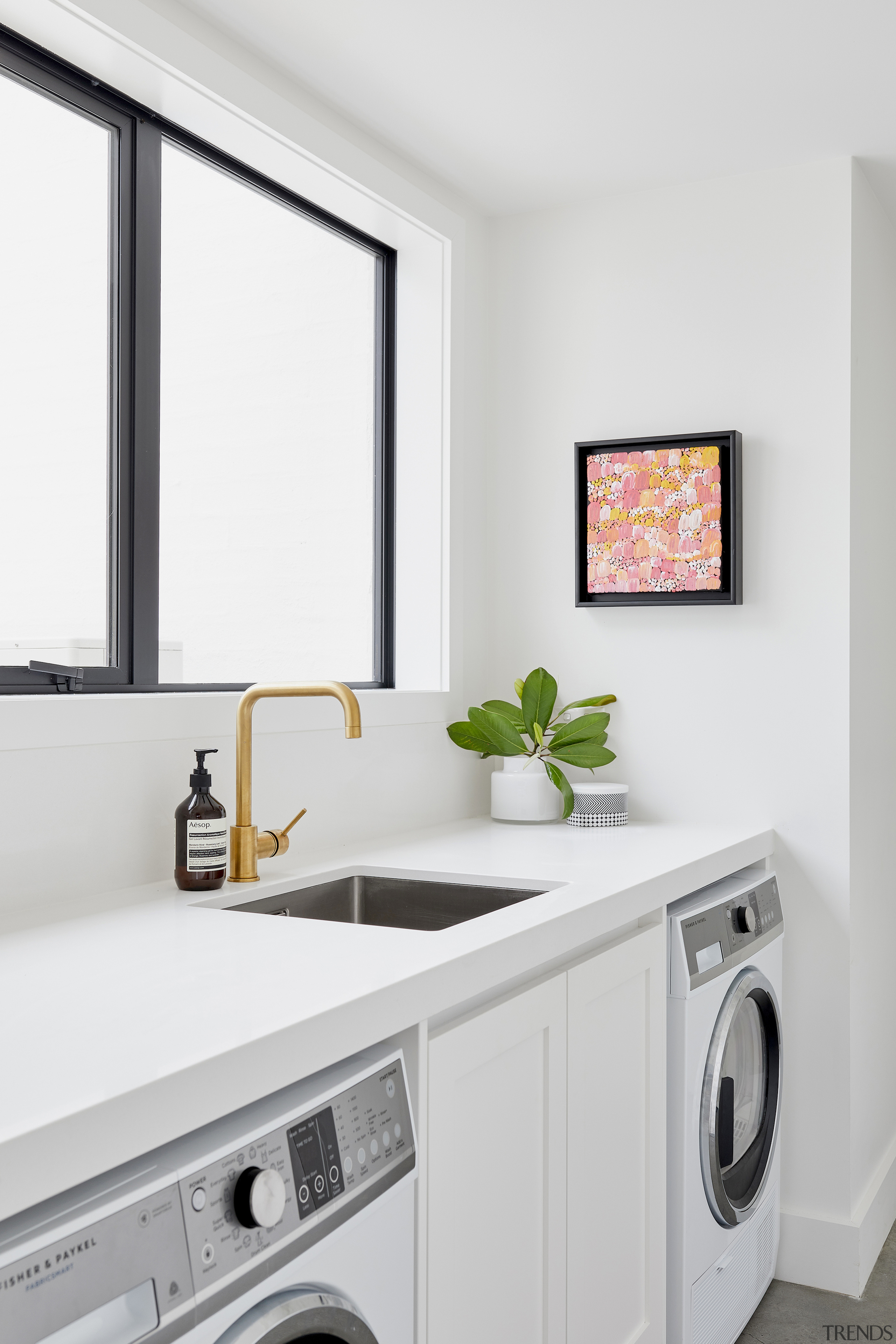 Light wall tones abound, including in the laundry. 