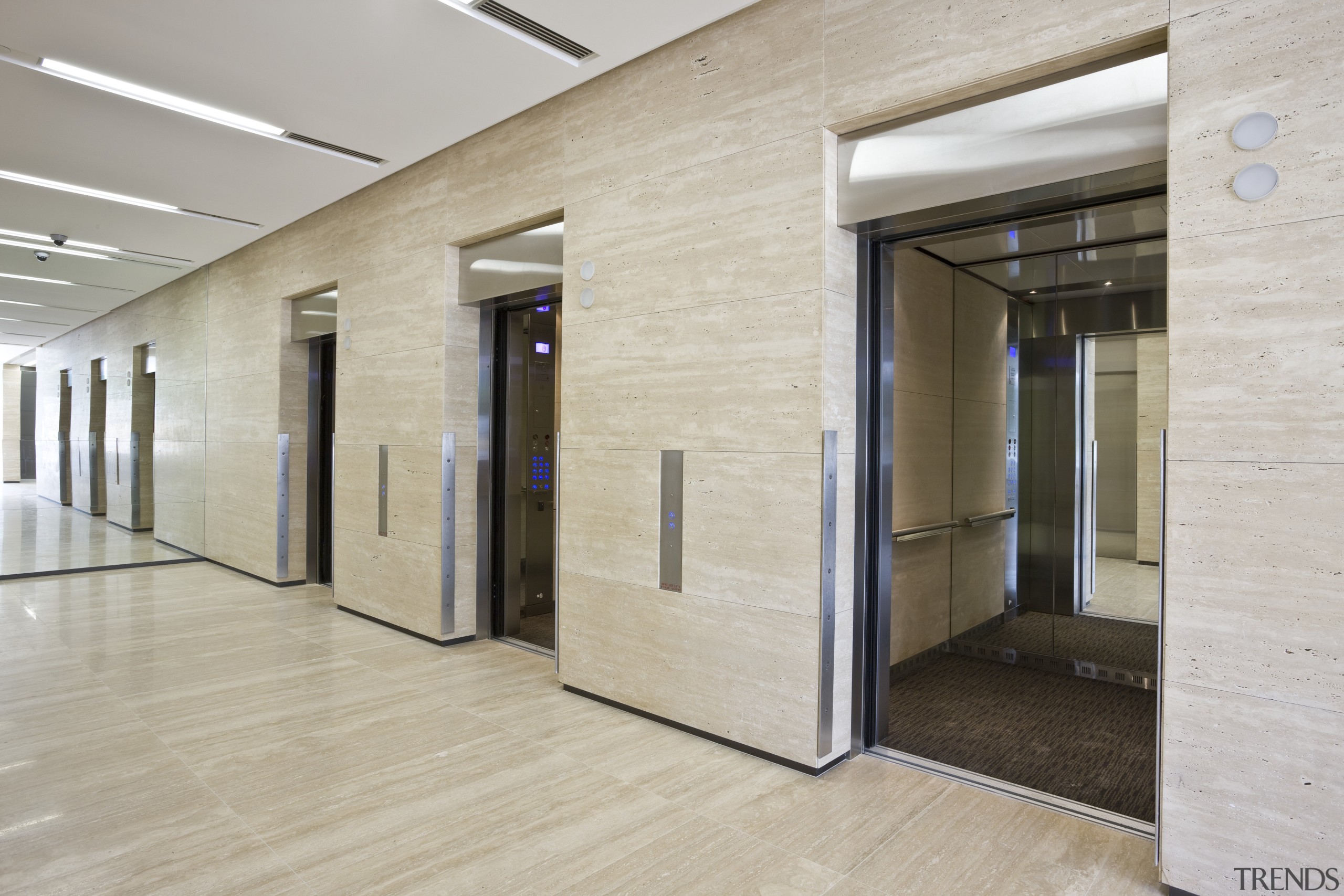 Interior view of the eco-friendly offices which were architecture, ceiling, door, floor, flooring, interior design, lobby, real estate, wall, gray