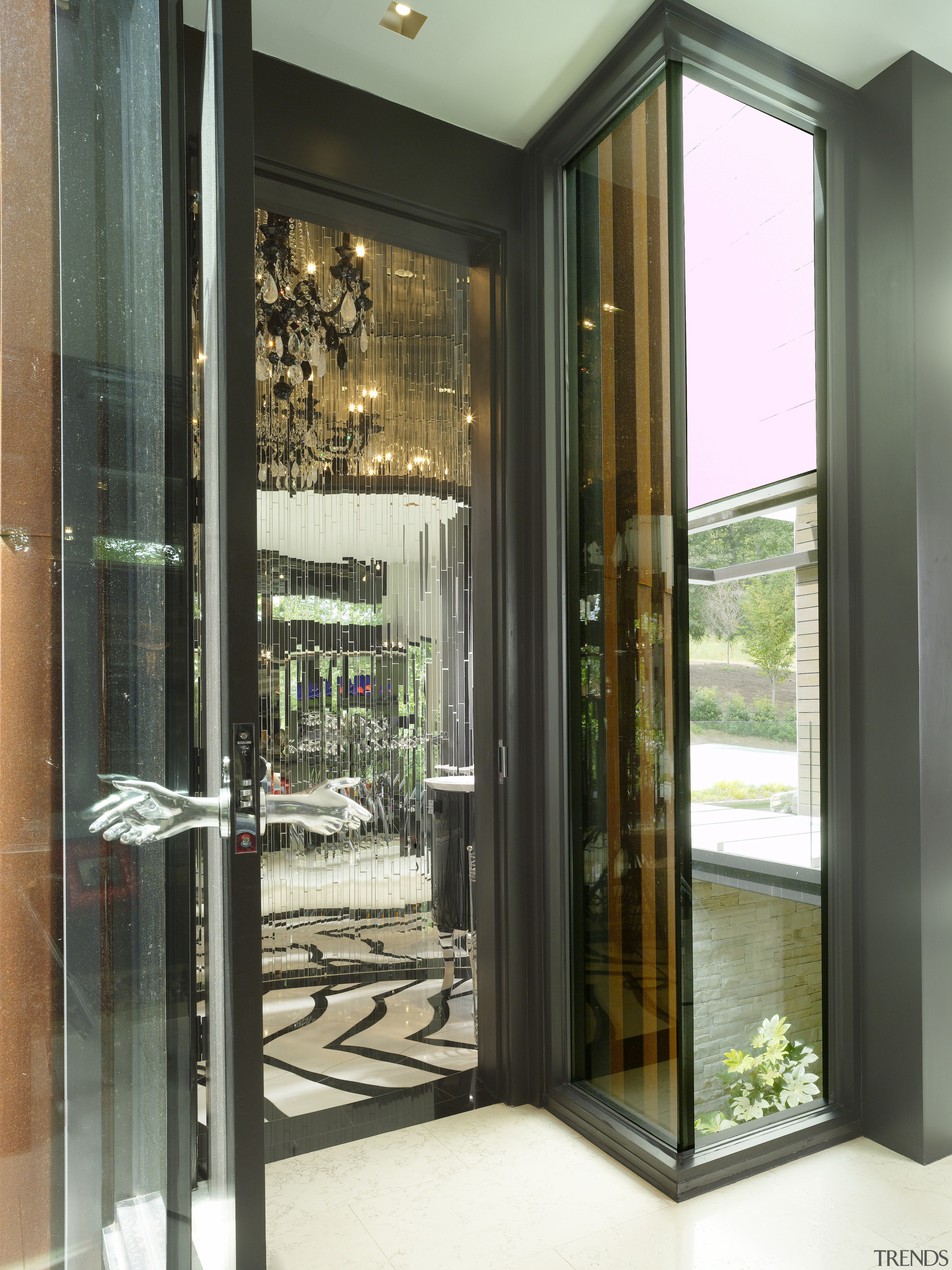 This glittering powder room, complete with mirrored walls door, interior design, window, black, gray